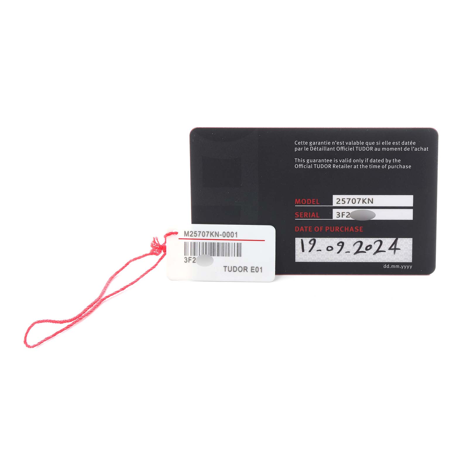 The image shows the warranty card and tag for a Tudor Pelagos M25707KN-0001 Men
s Stainless Steel Blue Dial M25707KN-0001 Men
s Stainless Steel Blue Dial model, with model, serial number, and purchase date visible.