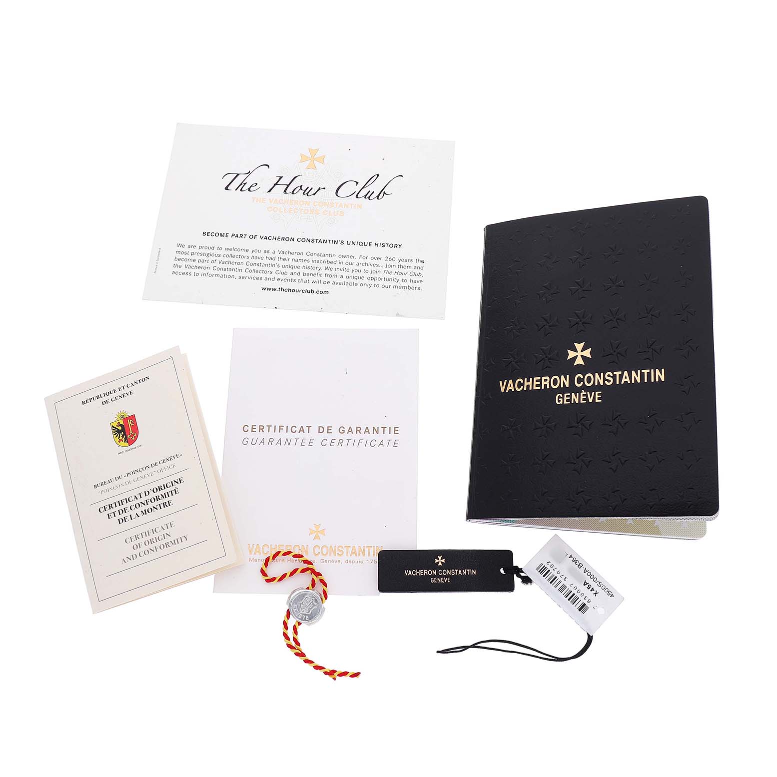 The image shows booklets, cards, tags, and a seal for the Vacheron Constantin Quai de l'Ile watch, viewed from above.