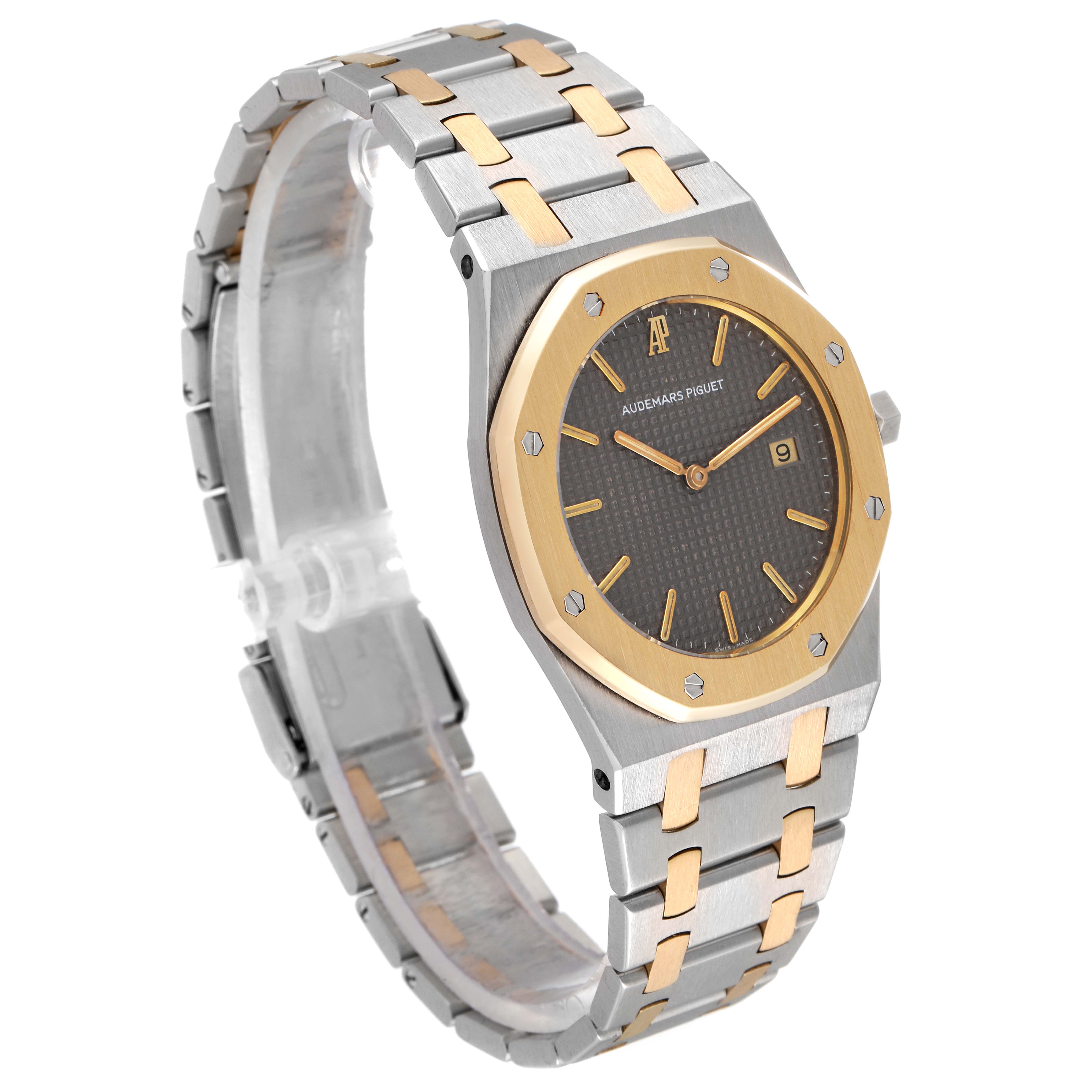 The image shows an angled view of the Audemars Piguet Royal Oak 56175SA.OO.0789SA.01 Men's Steel and Gold (two tone) Grey Dial 56175SA.OO.0789SA.01 Men's Steel and Gold (two tone) Grey Dial watch, highlighting its two-tone bracelet, dial, and octagonal bezel.