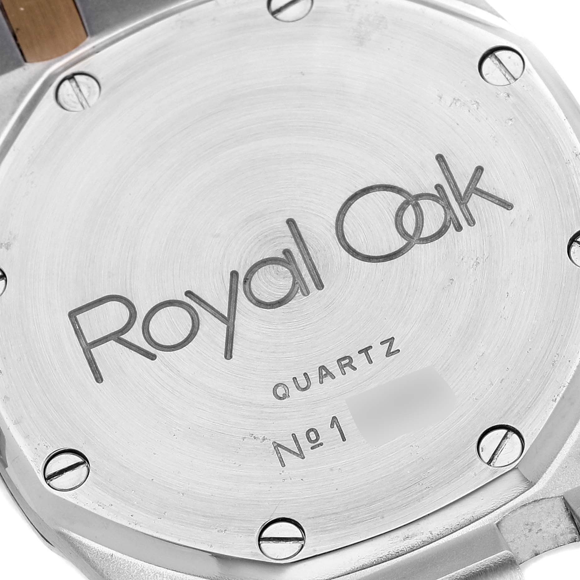 The image shows the case back of a Royal Oak model by Audemars Piguet, displaying the brand name and serial number.