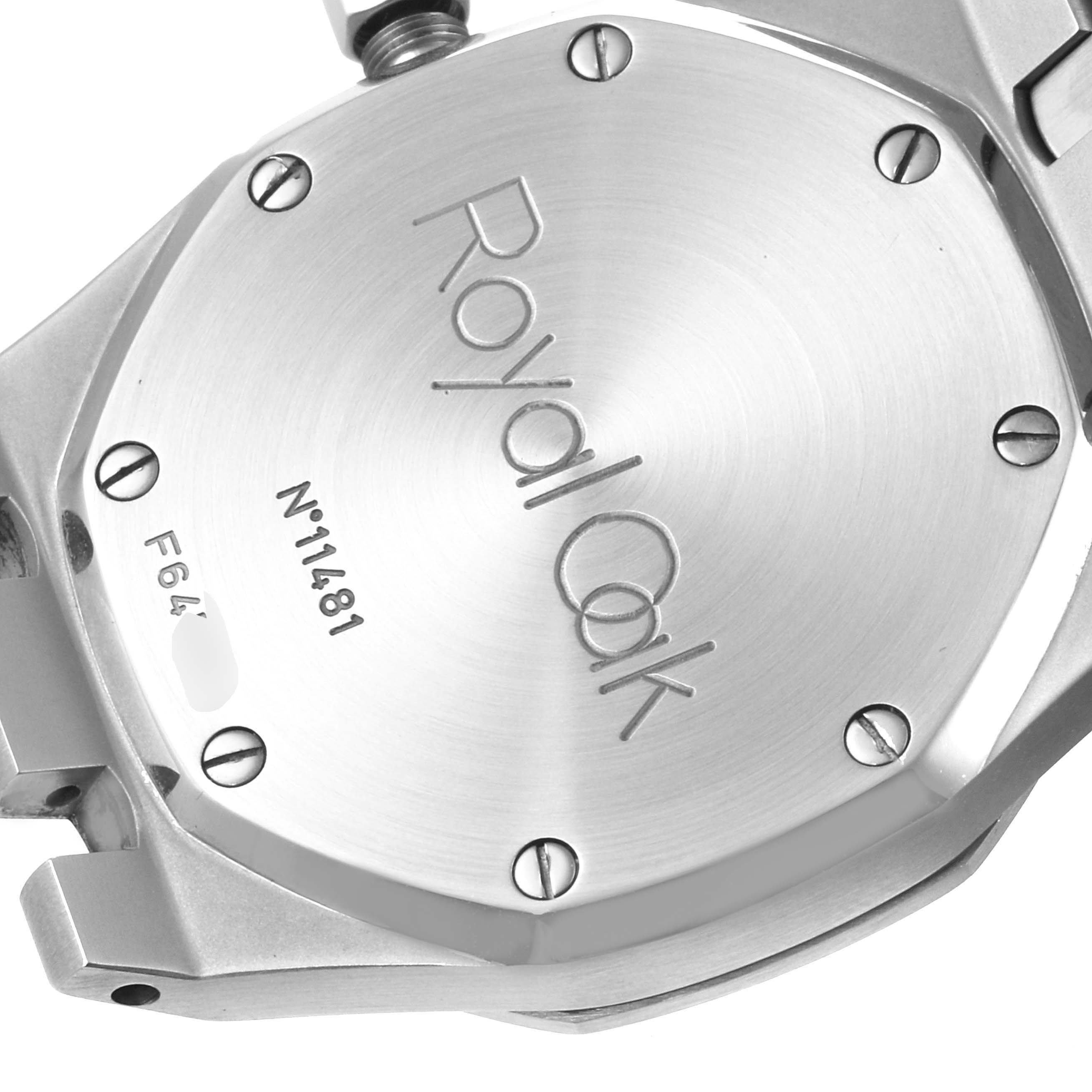 The image shows the back case of a Royal Oak model by Audemars Piguet, highlighting the engraved text and screws.