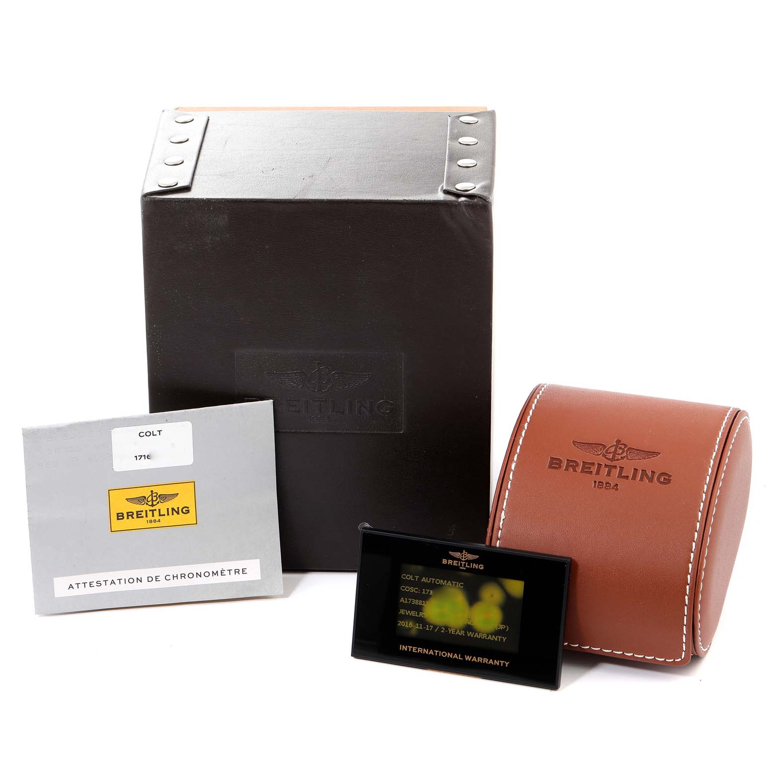 The image shows the packaging, warranty card, case, and documentation for a Breitling Colt A17388 Men
s Stainless Steel White Dial A17388 Men
s Stainless Steel White Dial watch.