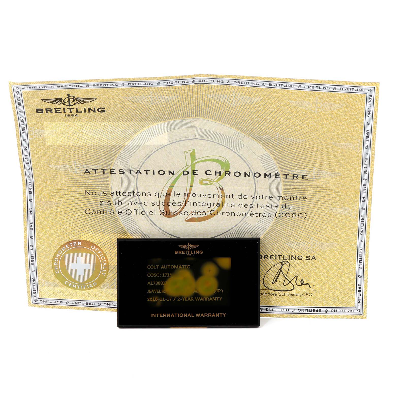 The image shows the warranty card and chronometer certificate for the Breitling Colt A17388 Men
s Stainless Steel White Dial A17388 Men
s Stainless Steel White Dial model.