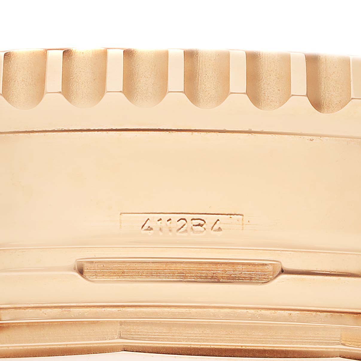 The image shows a close-up of the side of the Breitling Navitimer RB0120 Men
s Rose Gold Black Dial RB0120 Men
s Rose Gold Black Dial watch bezel with the model number visible.