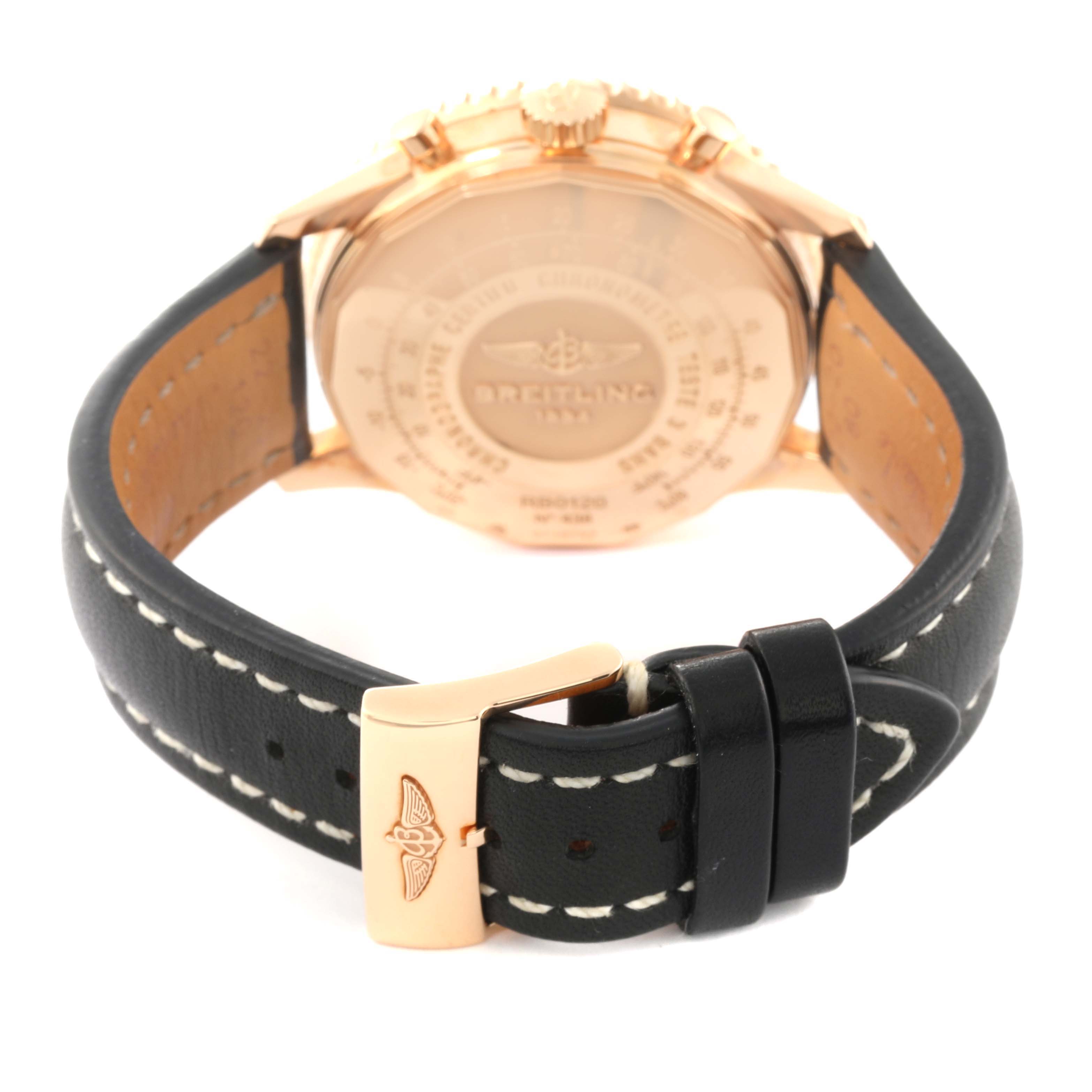 The image shows the rear view of a Breitling Navitimer RB0120 Men
s Rose Gold Black Dial RB0120 Men
s Rose Gold Black Dial watch, highlighting the case back and leather strap with buckle.