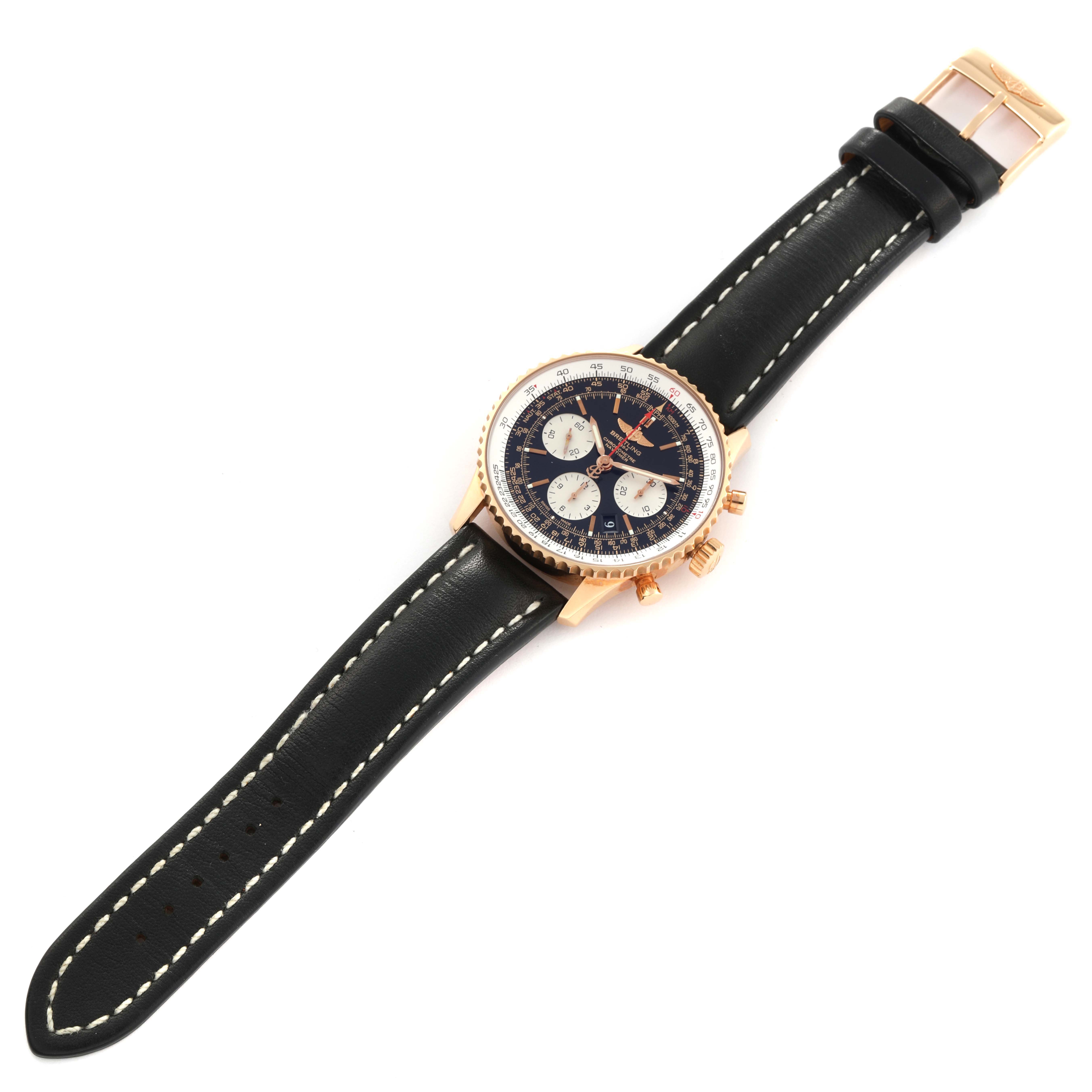 The image shows a Breitling Navitimer RB0120 Men
s Rose Gold Black Dial RB0120 Men
s Rose Gold Black Dial watch from a top-down angle, displaying the face, case, buttons, and leather strap.