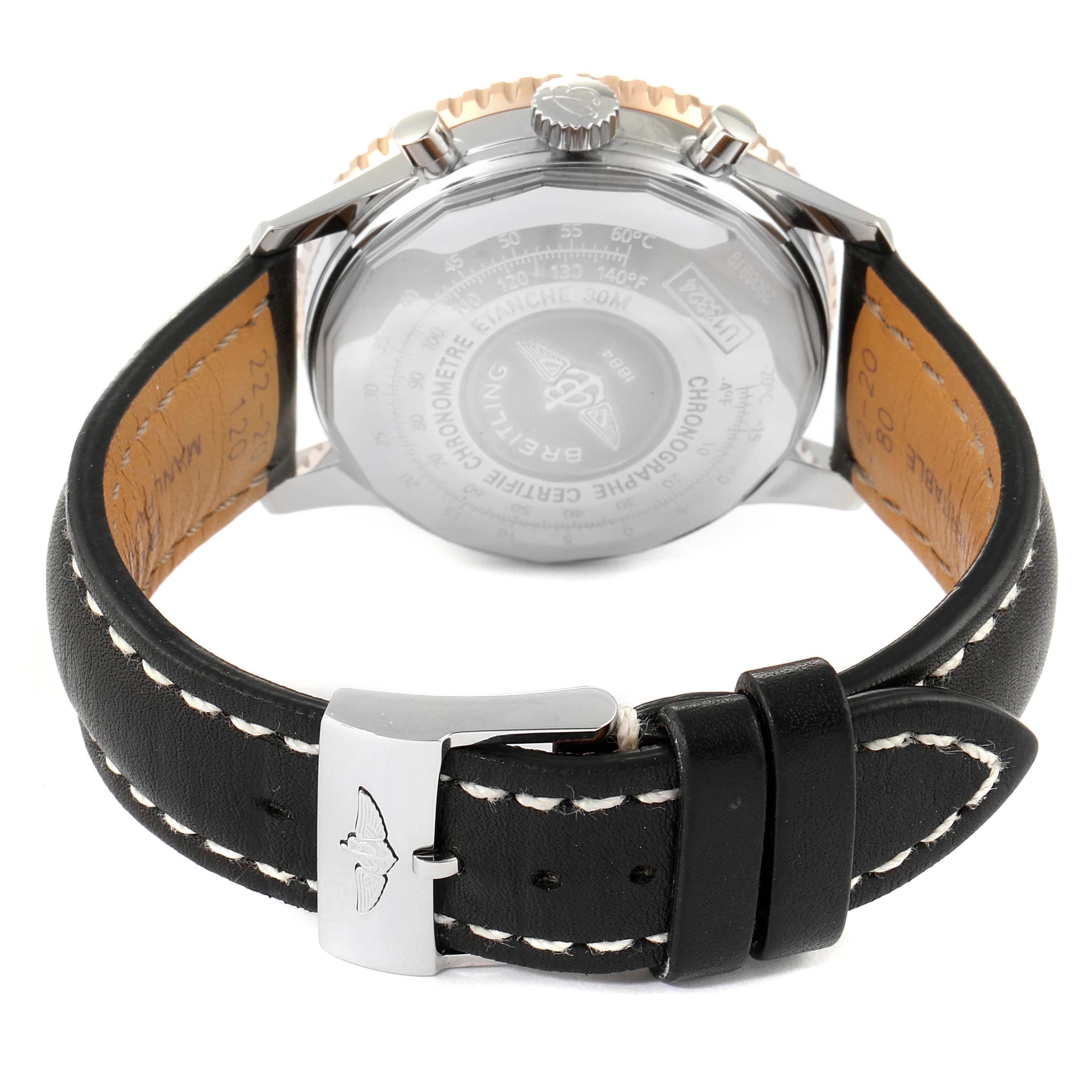 The image shows the back view of a Breitling Navitimer U13324211B1X1 Men
s Steel and Gold (two tone) Black Dial U13324211B1X1 Men
s Steel and Gold (two tone) Black Dial watch, featuring the case back, crown, and leather strap with a clasp.