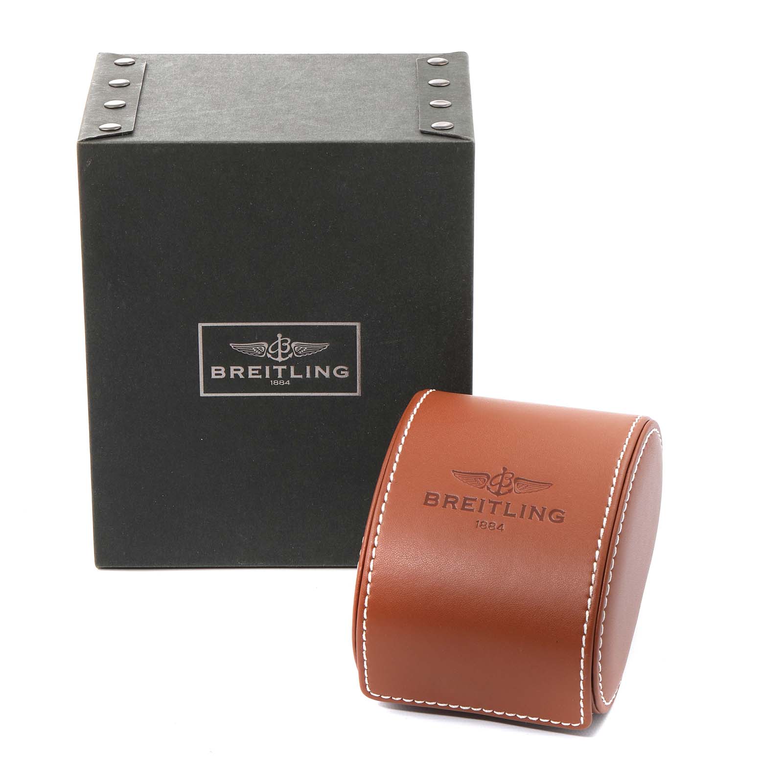 This image shows the packaging for a Breitling Navitimer U13324211B1X1 Men
s Steel and Gold (two tone) Black Dial U13324211B1X1 Men
s Steel and Gold (two tone) Black Dial, featuring a black box and a brown leather case.