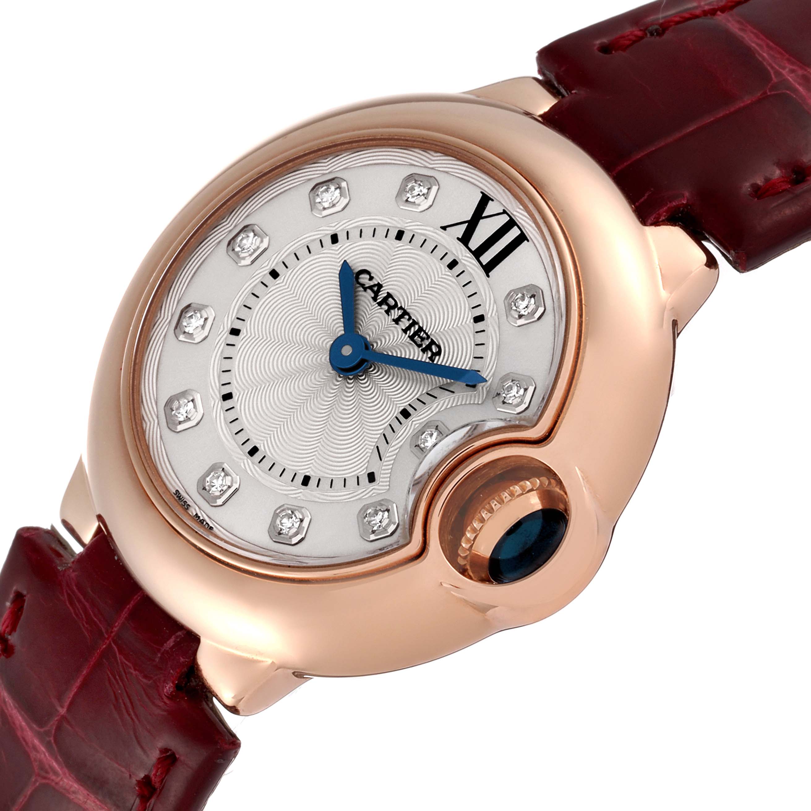 This image shows a frontal view of a Cartier Ballon Bleu WE902050 Women
s Rose Gold Silver Dial WE902050 Women
s Rose Gold Silver Dial watch with a rose gold case, diamond markers, and blue hands.