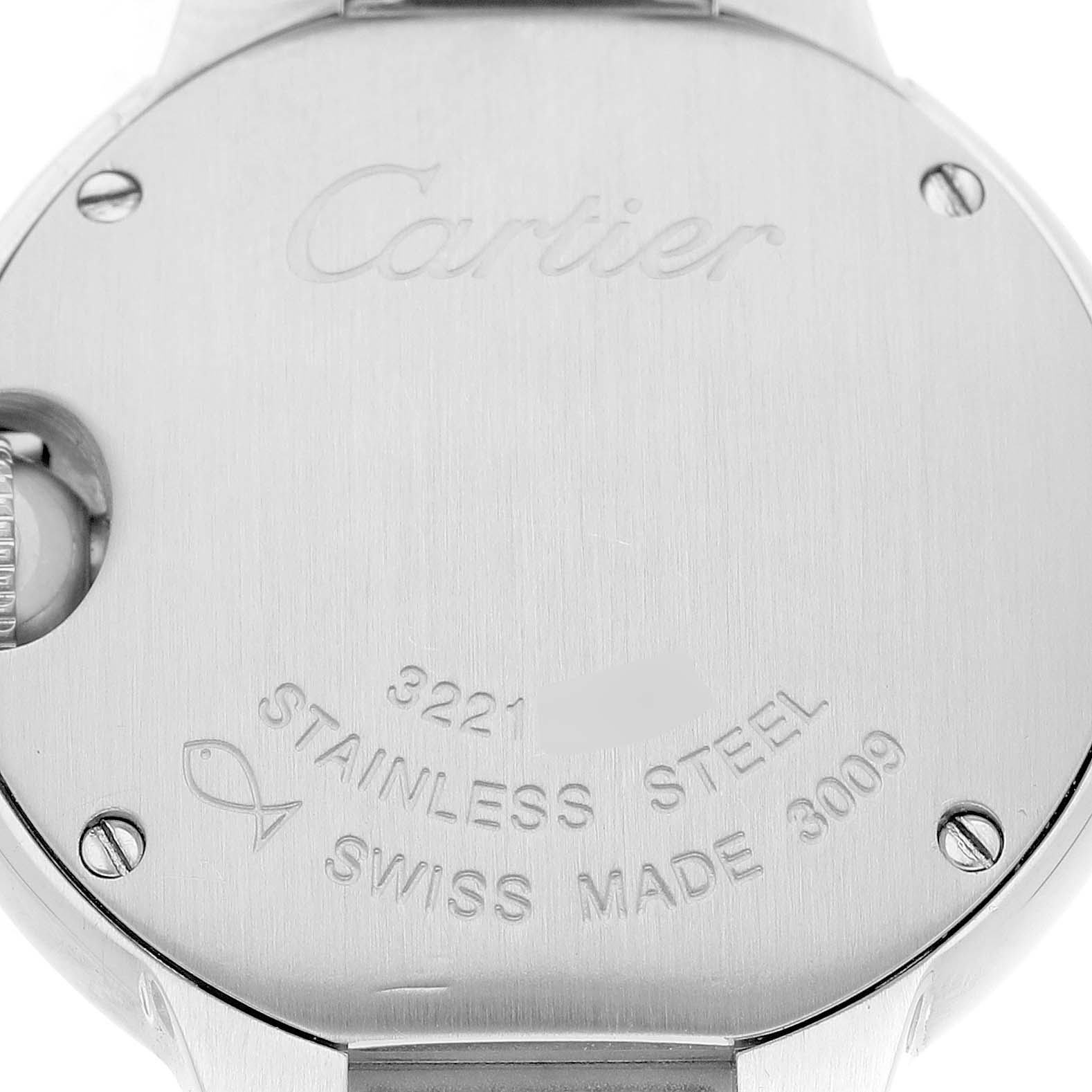The image shows the back of a Ballon Bleu de Cartier watch, highlighting the engraved details and stainless steel case.