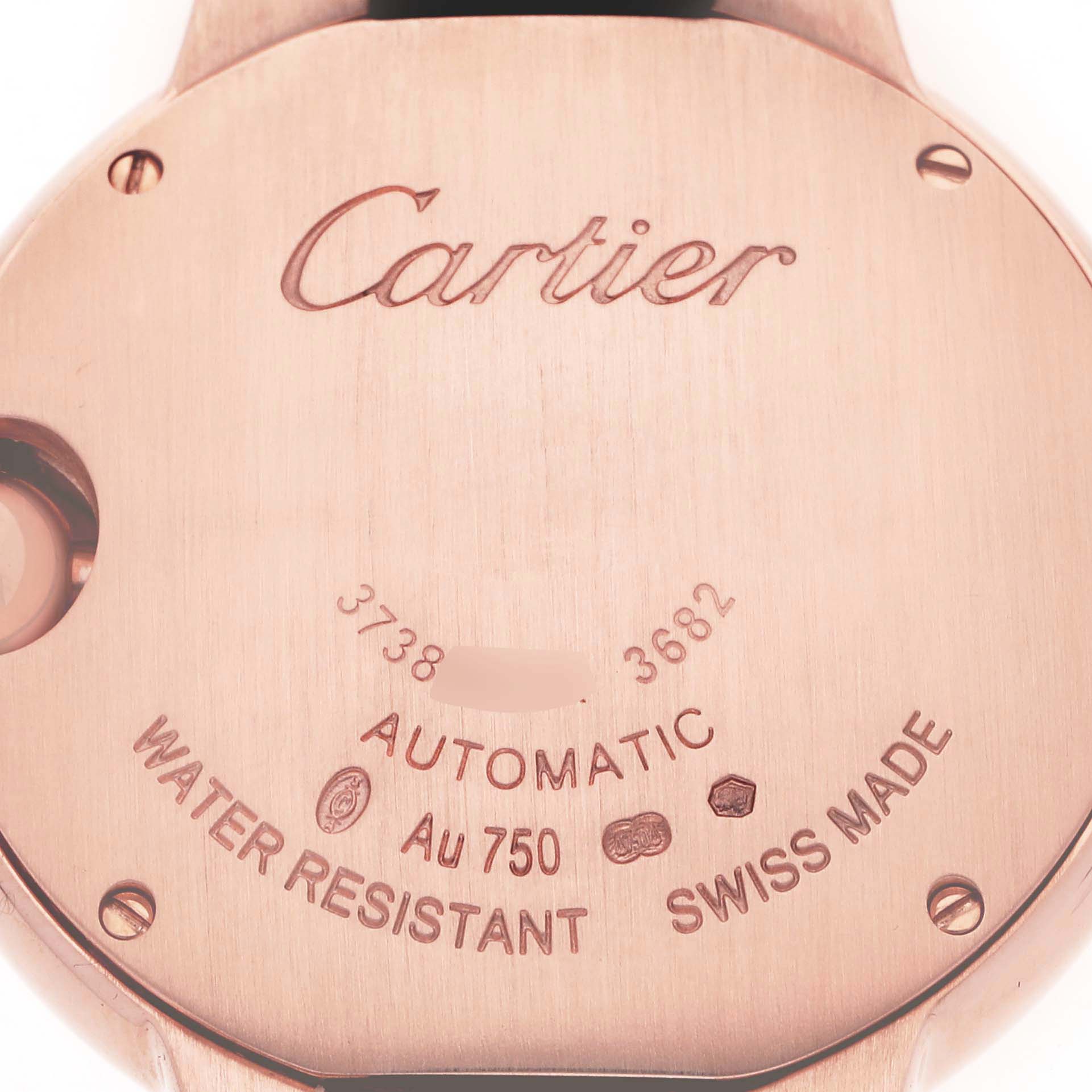 The image shows the back of the Cartier Ballon Bleu WE902066 Women
s Rose Gold Silver Dial WE902066 Women
s Rose Gold Silver Dial watch, focusing on engravings and details.