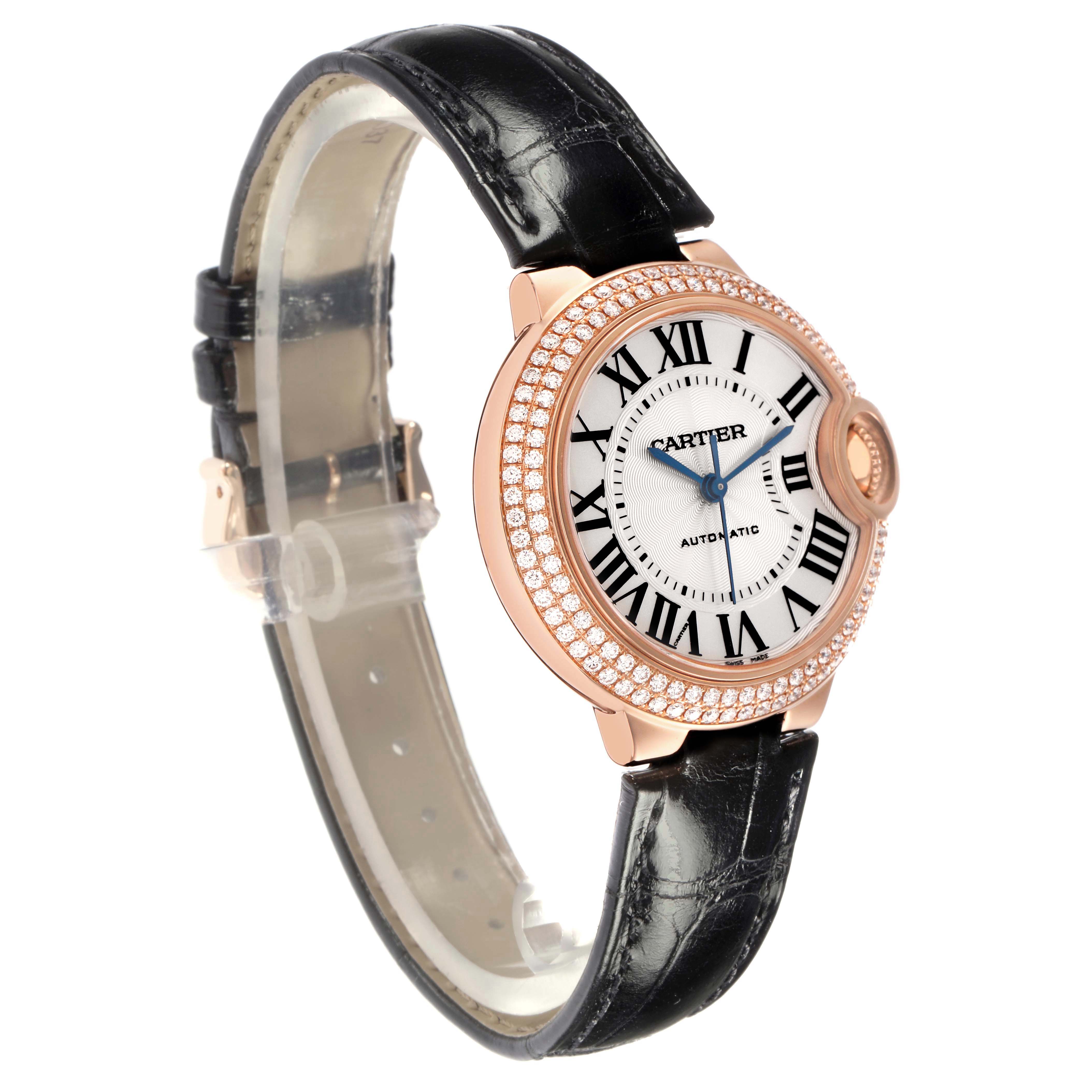 The Cartier Ballon Bleu WE902066 Women's Rose Gold Silver Dial watch is shown at a side angle, displaying the bezel, dial, and black leather strap.