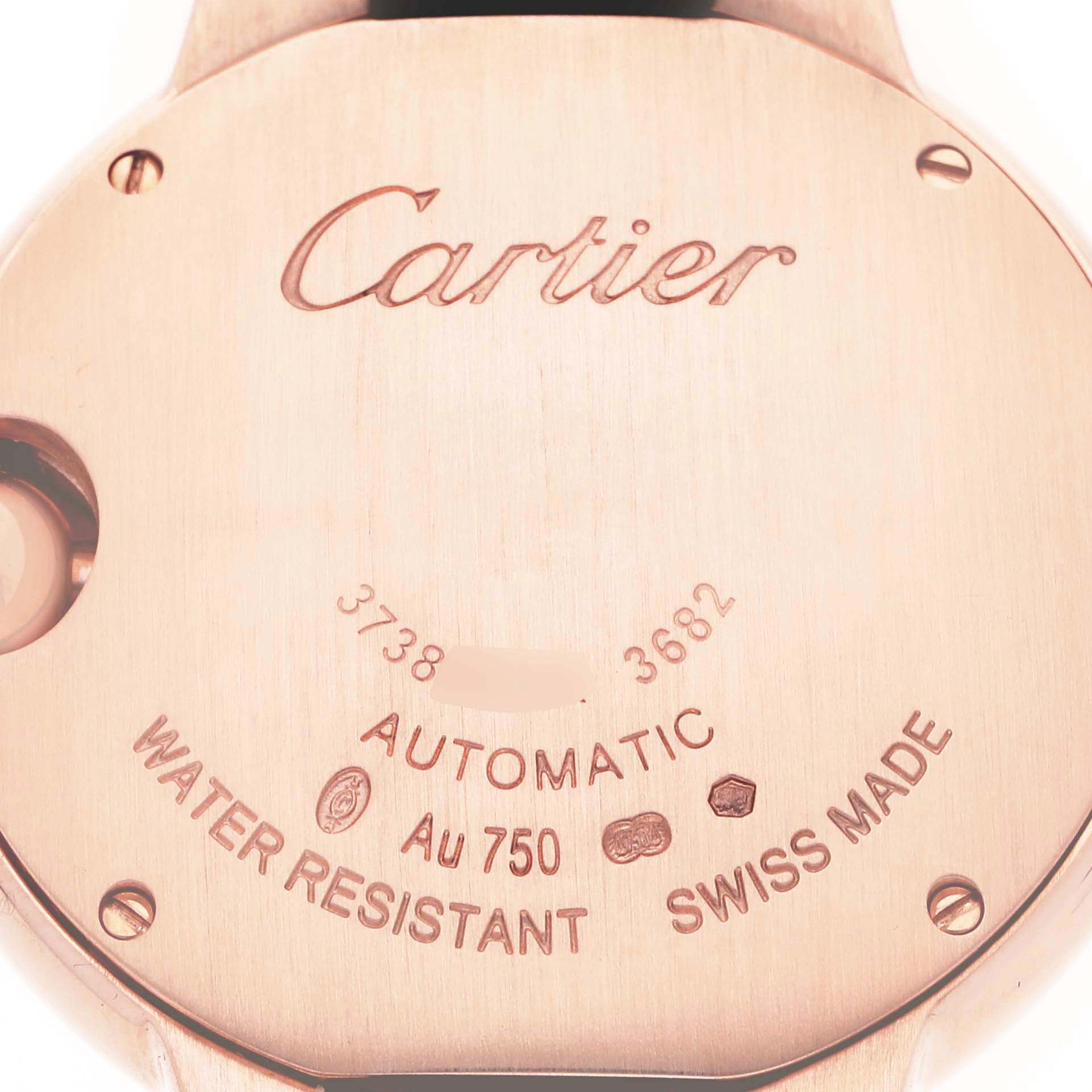 The image shows the back of a Cartier Ballon Bleu WE902066 Women's Rose Gold Silver Dial watch, highlighting engravings and markings for authenticity and specifications.