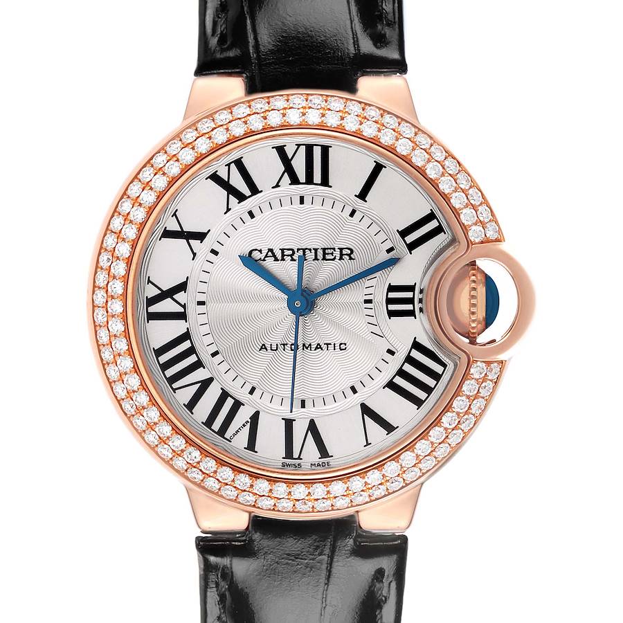 The Cartier Ballon Bleu watch is shown from the front, displaying its dial, Roman numerals, diamond bezel, and leather strap.