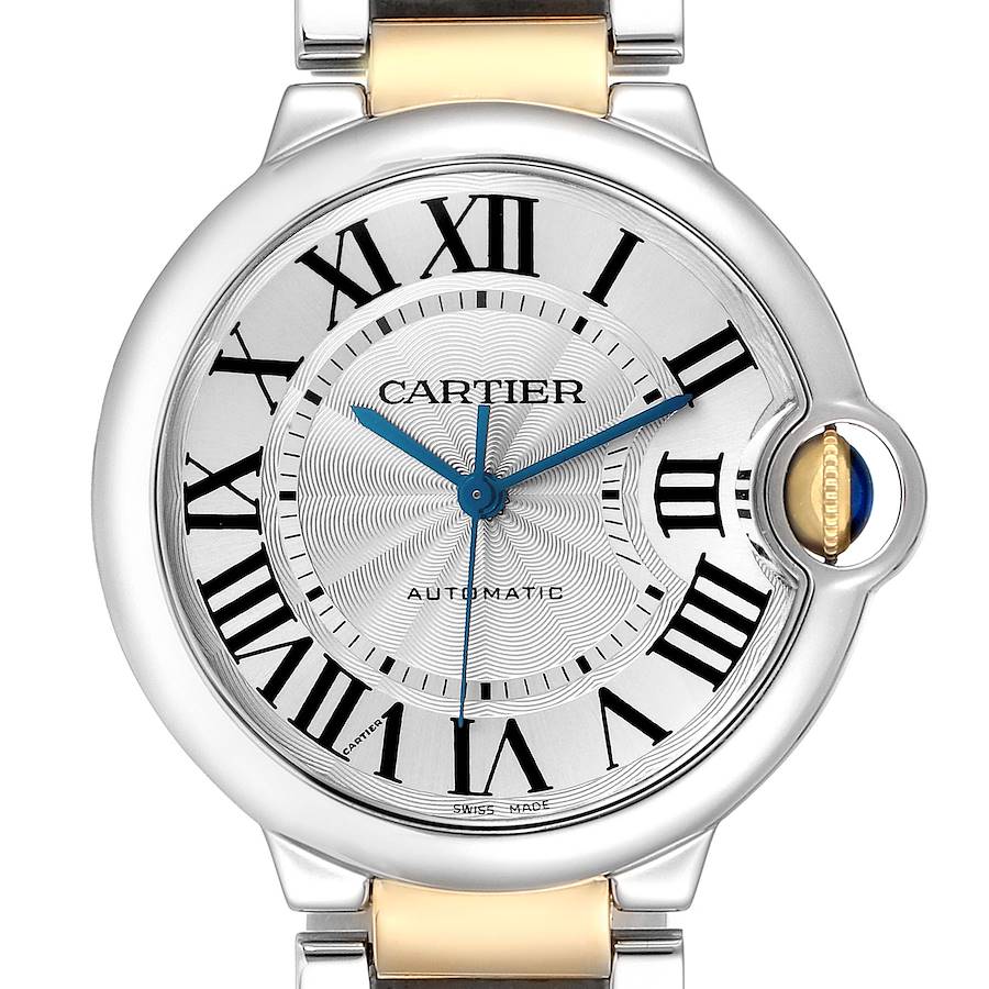 The Cartier Ballon Bleu watch is shown from the front, displaying its face, Roman numerals, and fluted crown with blue cabochon.
