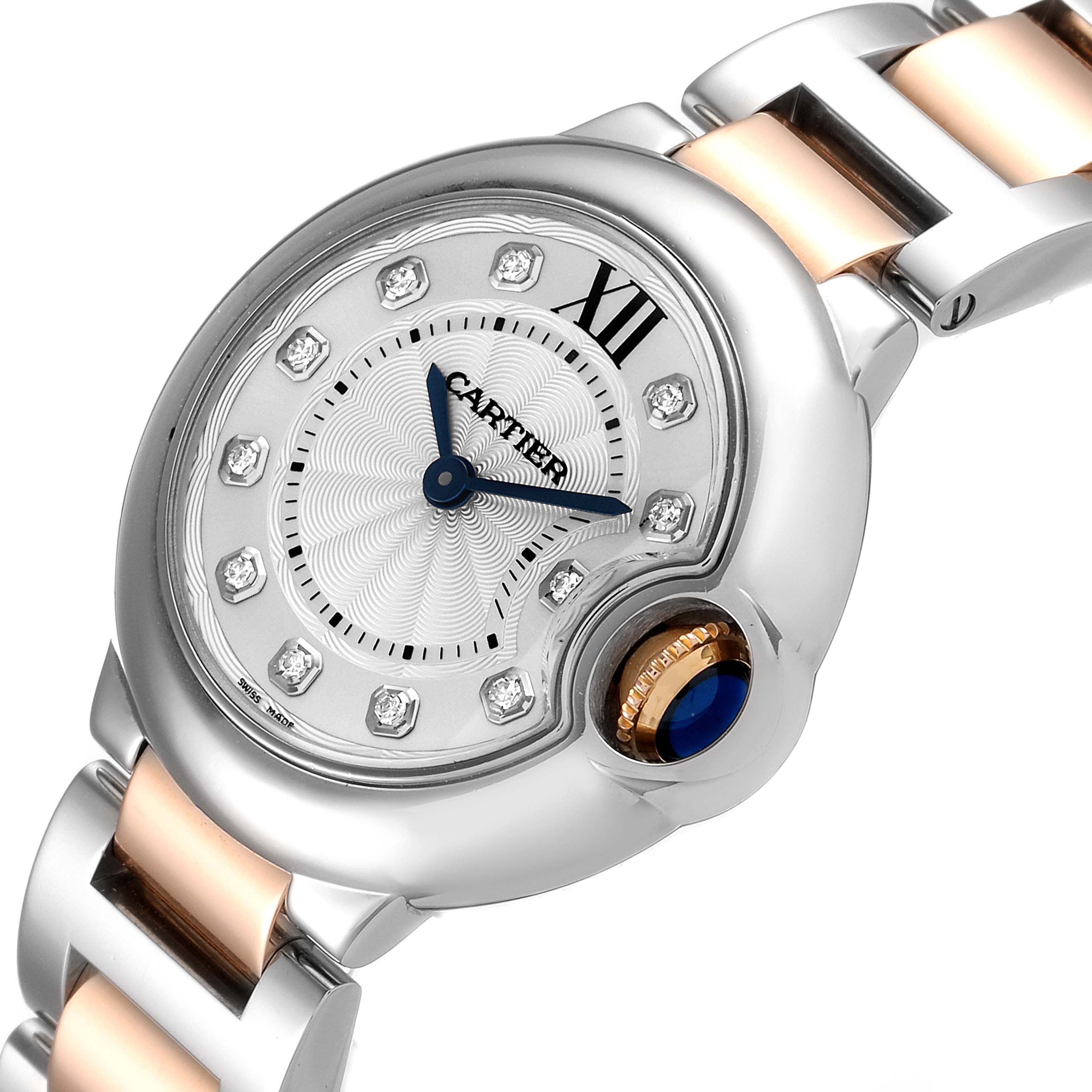 The image shows a close-up of the dial and part of the bracelet of the Cartier Ballon Bleu WE902030 Women's Steel and Gold (two tone) Silver Dial WE902030 Women's Steel and Gold (two tone) Silver Dial watch.