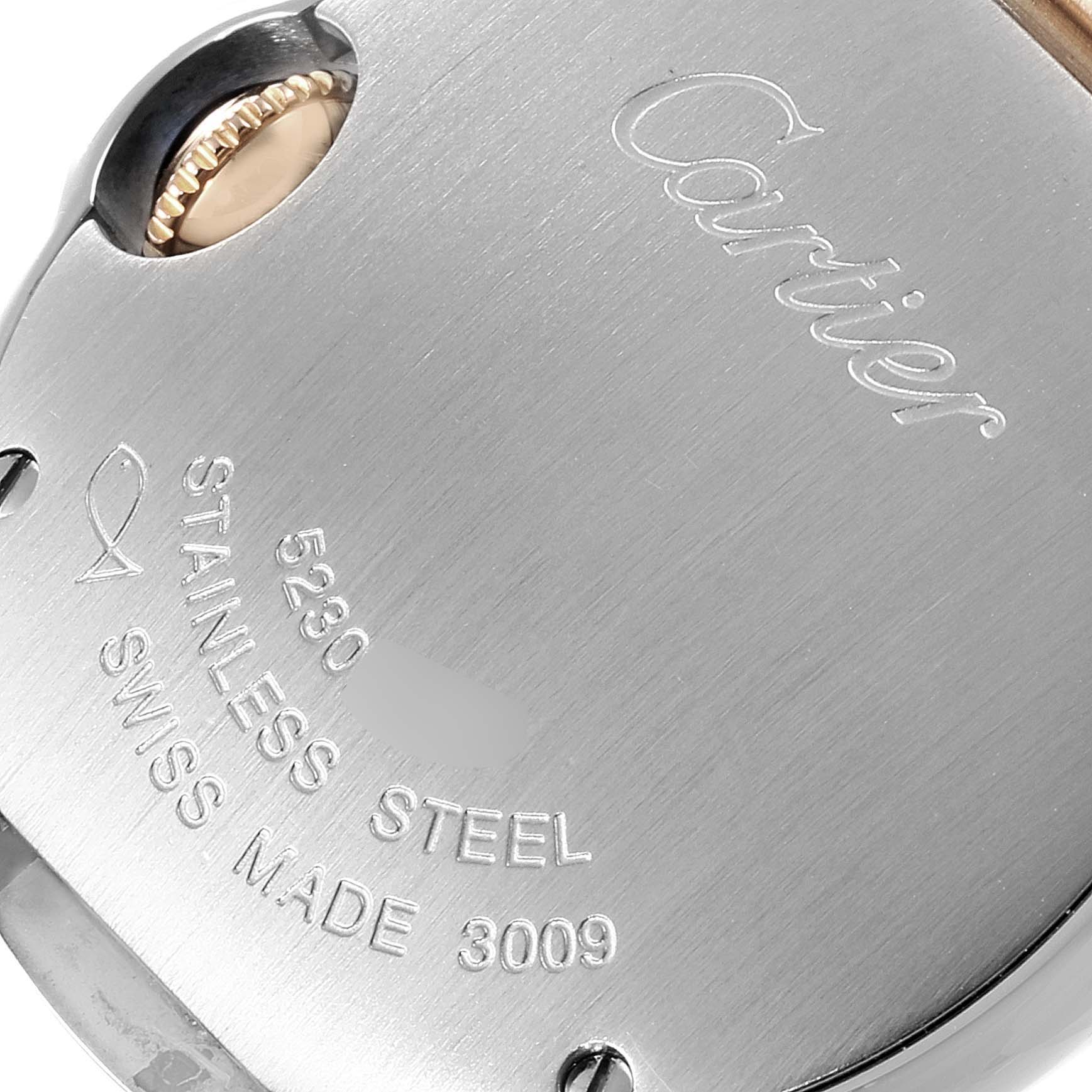 This image shows the back of the Cartier Ballon Bleu WE902030 Women's Steel and Gold (two tone) Silver Dial WE902030 Women's Steel and Gold (two tone) Silver Dial watch, highlighting the crown and inscription details.