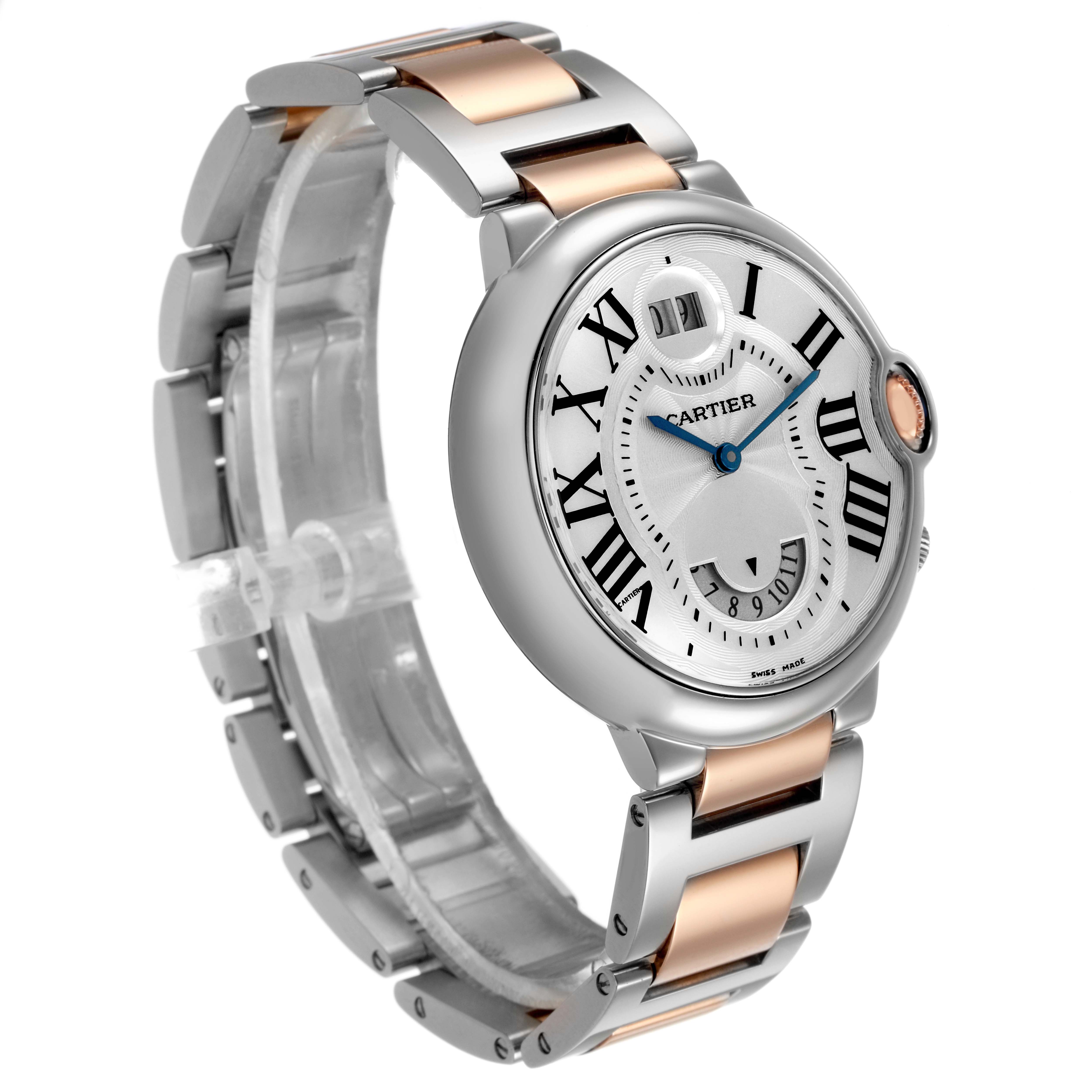 The Cartier Ballon Bleu W6920027 Men's Stainless Steel Silver Dial watch is shown from a three-quarter angle, featuring its round face, Roman numerals, and two-tone bracelet.