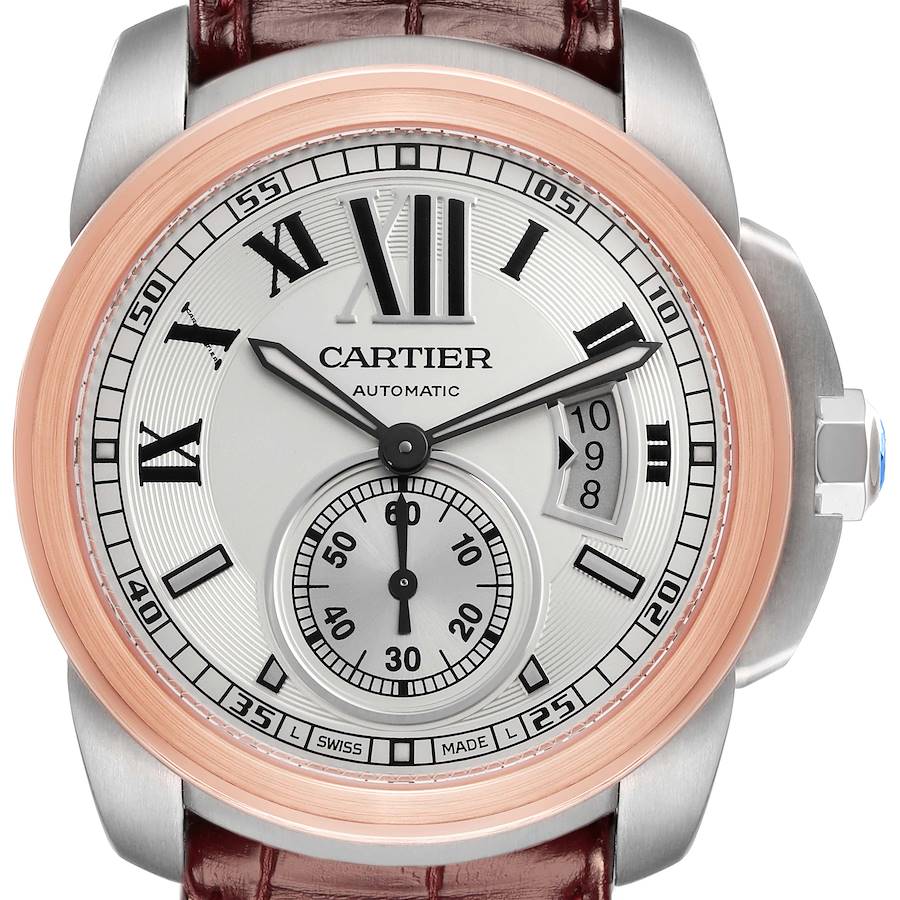 The image shows a frontal view of the Calibre de Cartier watch by Cartier, highlighting its dial, hands, and case.