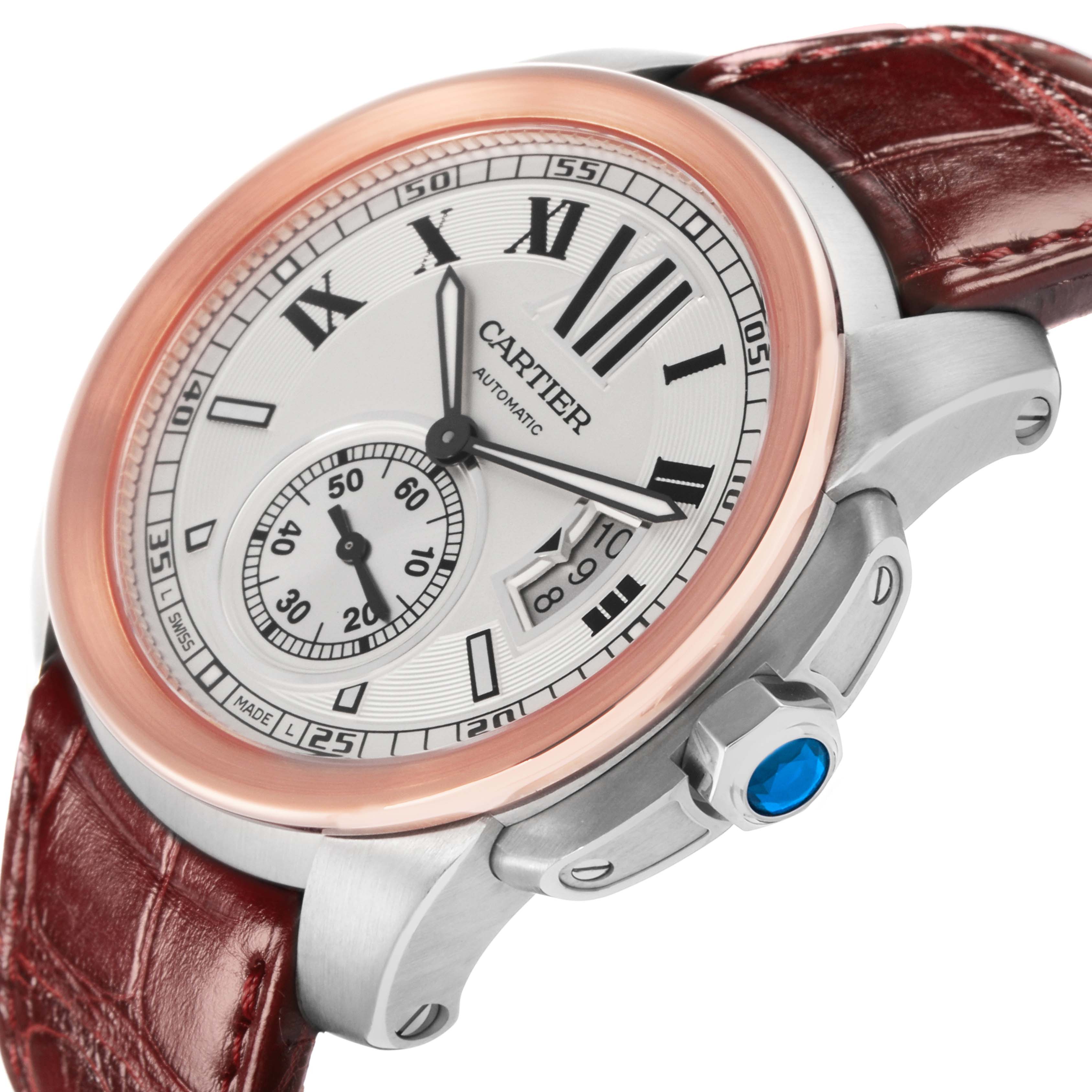 The Calibre de Cartier watch is shown at an angled side view, highlighting the face, bezel, crown, and leather strap.