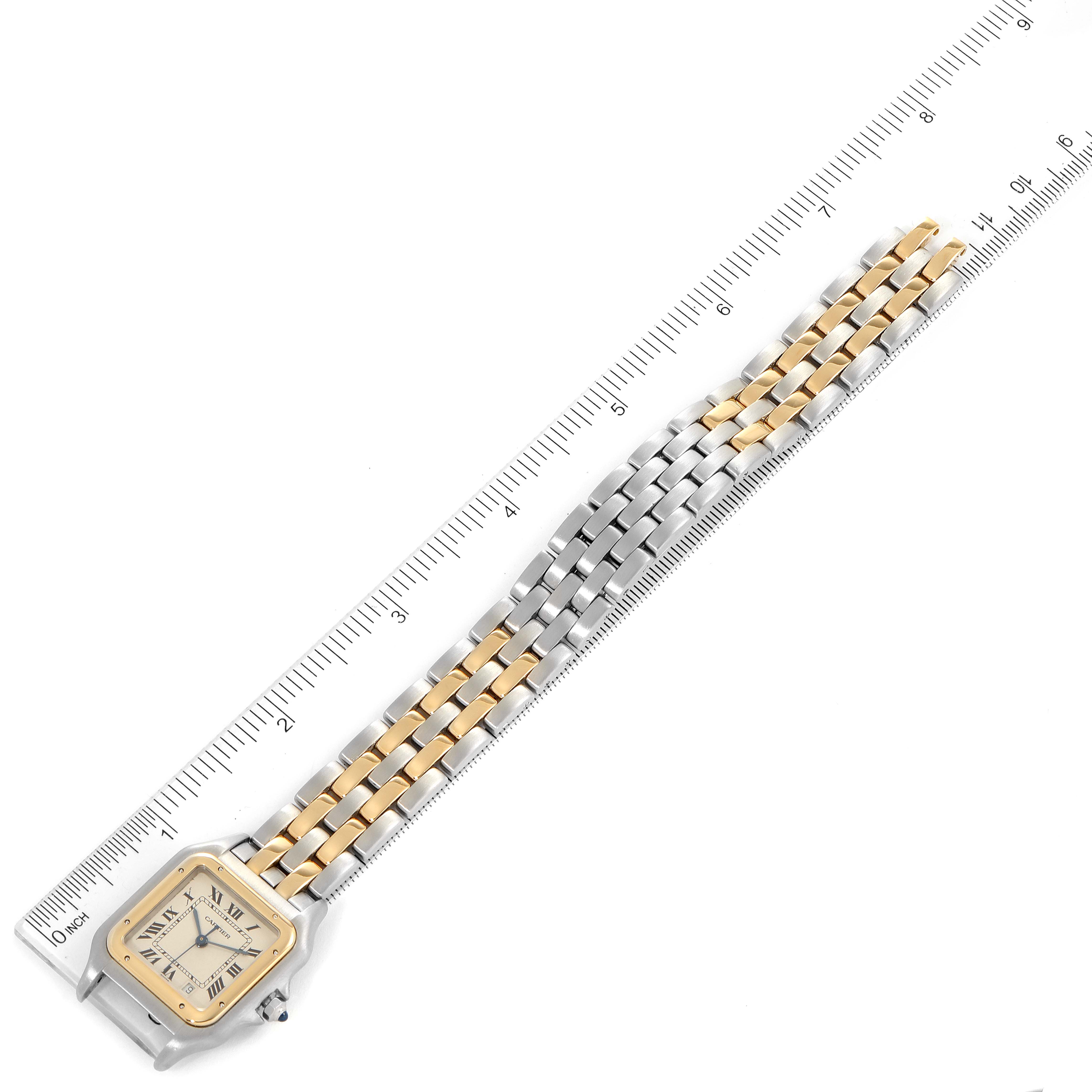The image shows a Panthere model by Cartier at an angled top-down view with a ruler for scale, displaying the face and full bracelet.