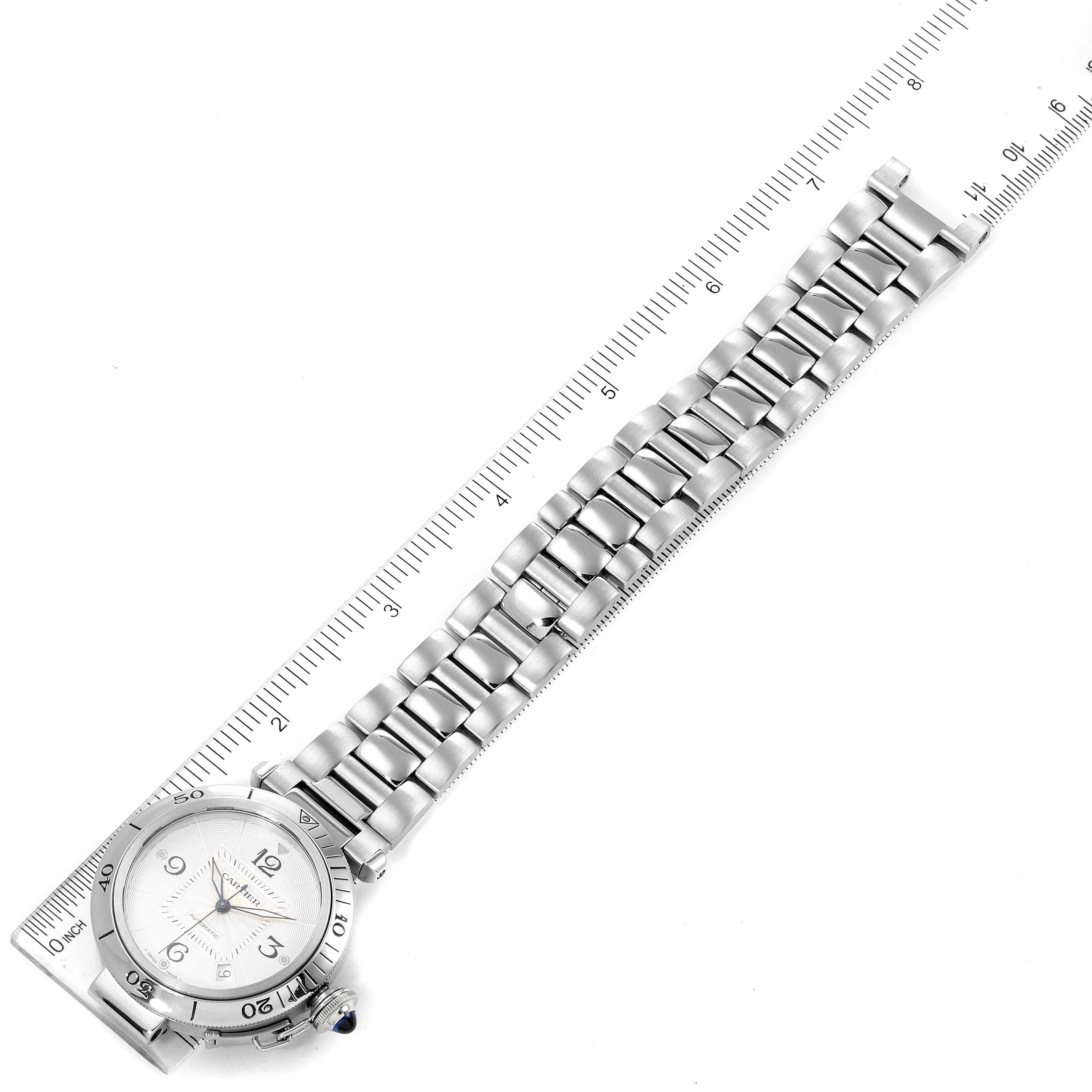 The image shows a Cartier Pasha W31059H3 Men
s Stainless Steel Silver Dial W31059H3 Men
s Stainless Steel Silver Dial watch laid flat with a ruler alongside, displaying the full bracelet and watch face.