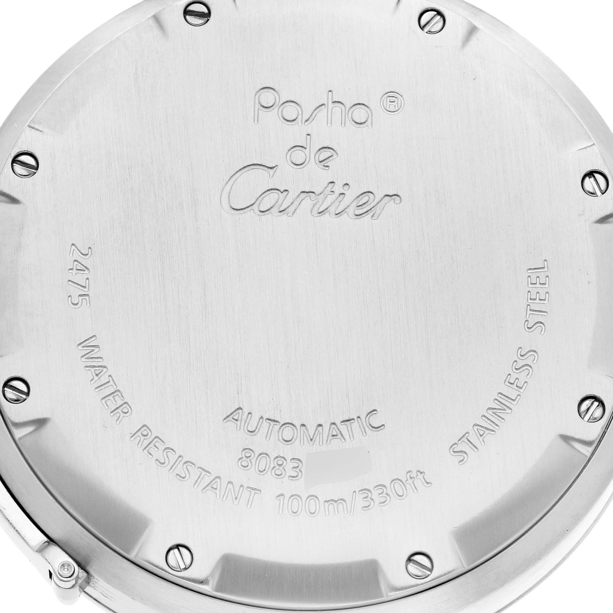 This image shows a close-up of the back case of a Cartier Pasha W31055M7 Men's Stainless Steel Silver Dial W31055M7 Men's Stainless Steel Silver Dial watch, displaying its engravings and screws.