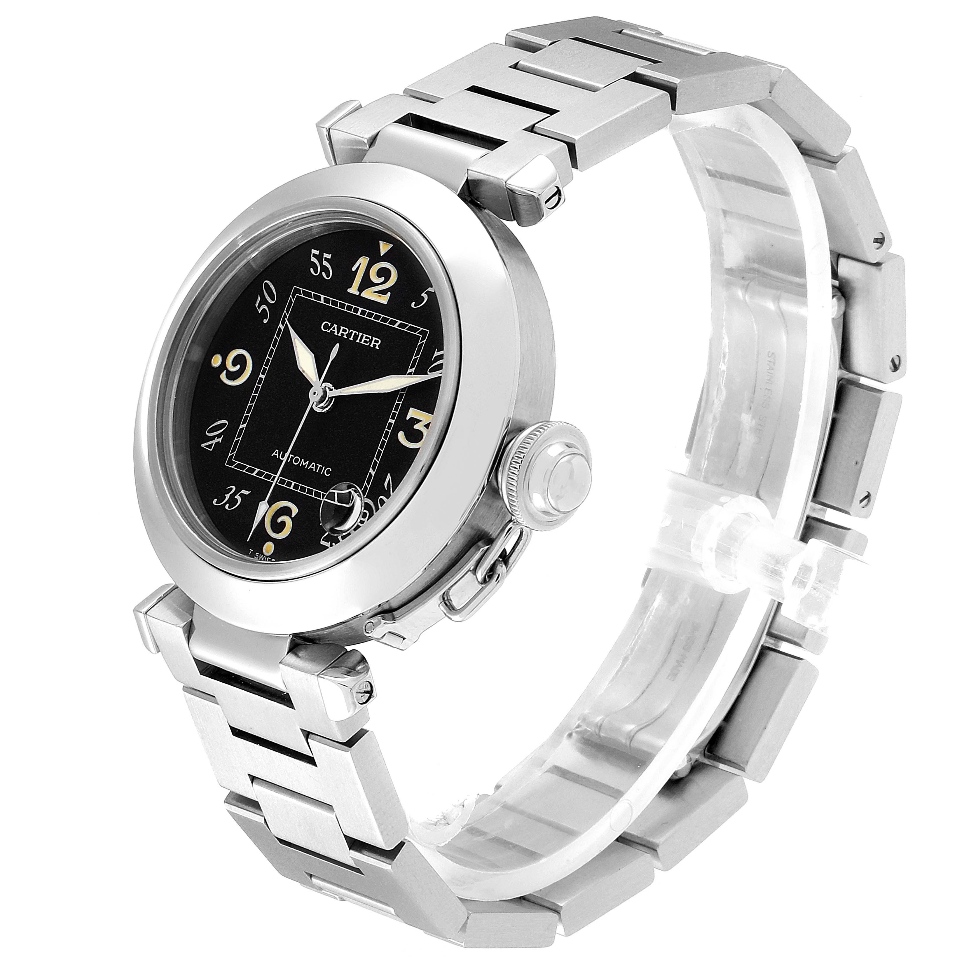 The image shows a Cartier Pasha W31043M7 Men's Stainless Steel Black Dial W31043M7 Men's Stainless Steel Black Dial watch angled to display the face, crown, and part of the bracelet.