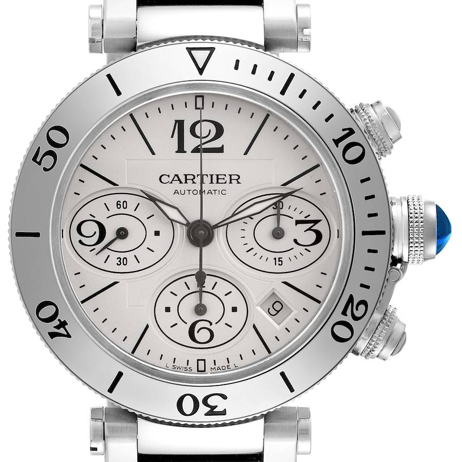 The Cartier Pasha watch is shown face-on, highlighting the bezel, dial, subdials, and blue cabochon crown.