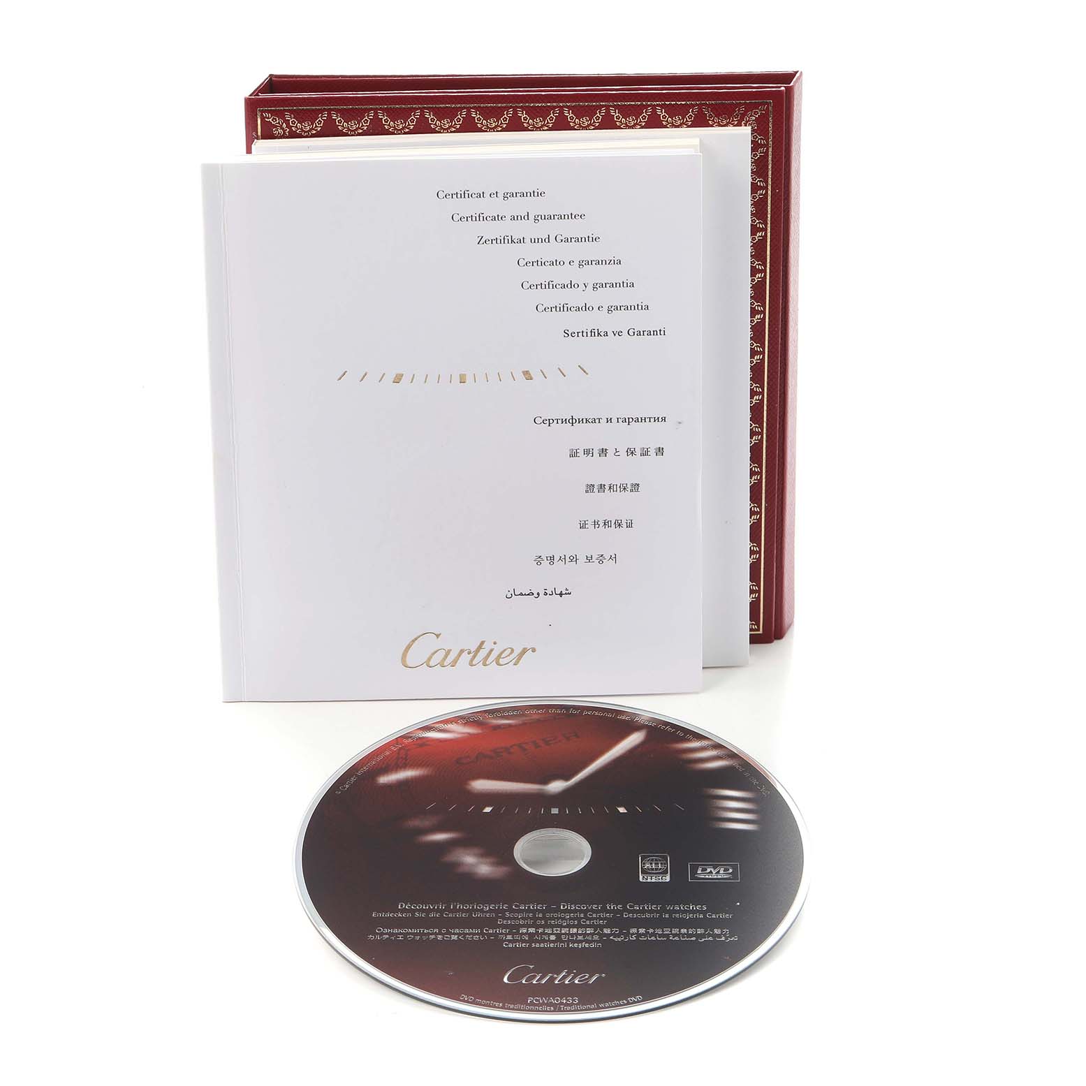 The image shows the Cartier Pasha W31089M7 Men
s Stainless Steel Silver Dial W31089M7 Men
s Stainless Steel Silver Dial model
s accessory set, including a certificate, book, and a CD.