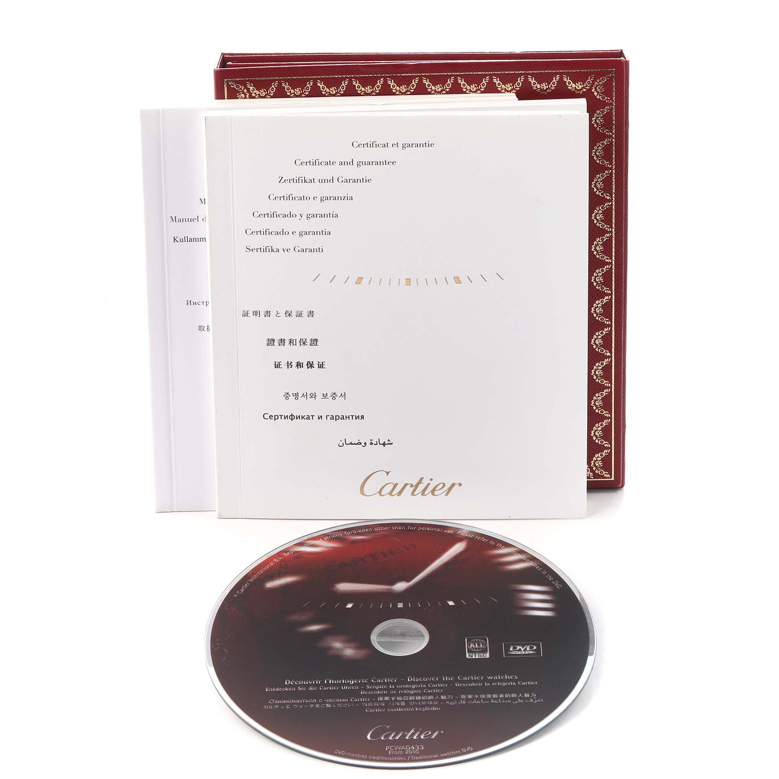 The image shows Cartier Roadster W62020X6 Men
s Stainless Steel Black Dial W62020X6 Men
s Stainless Steel Black Dial watch accessories, including a user manual, guarantee card, and a CD, angled slightly from the front.