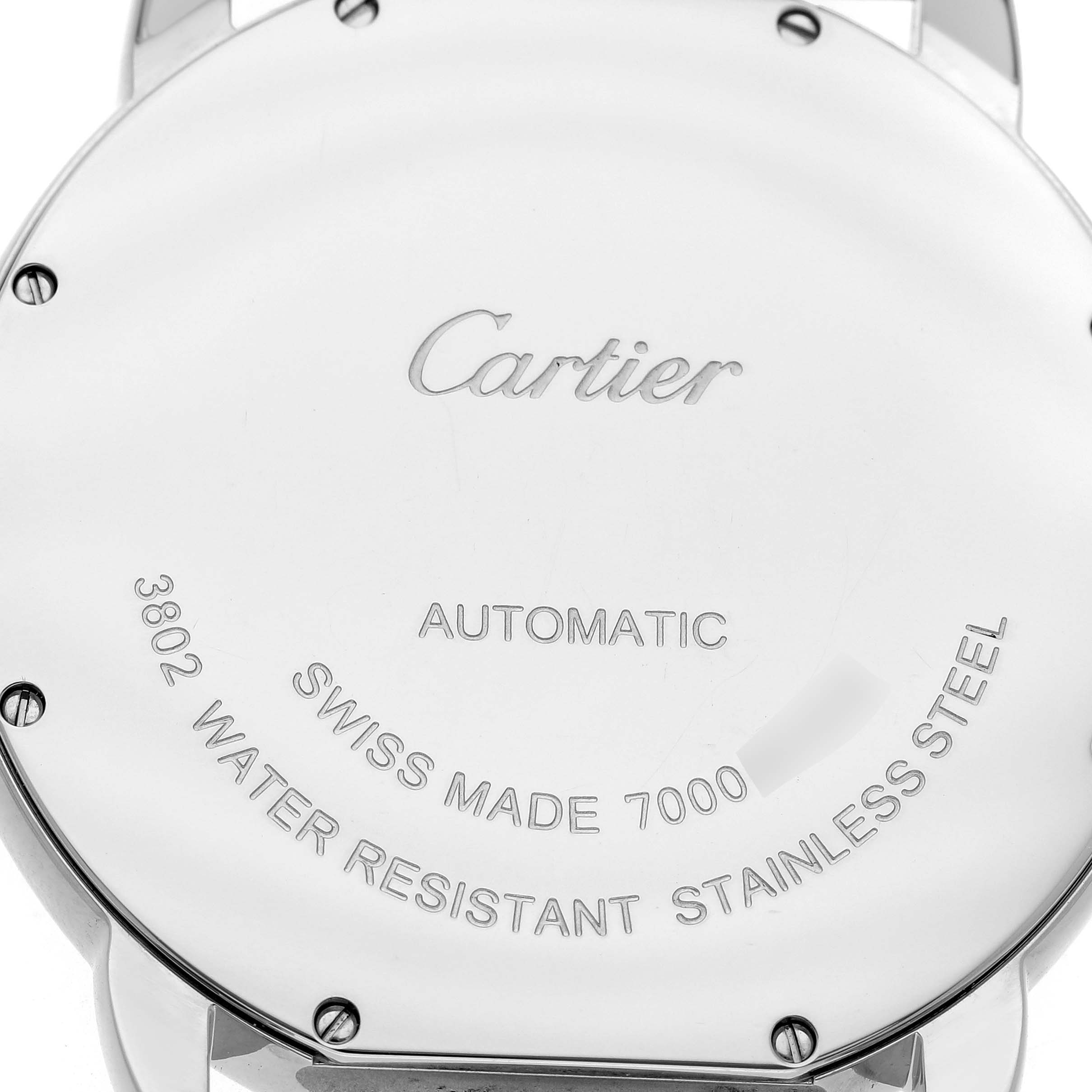 The image shows the case back of the Cartier Ronde WSRN0023 Men's Stainless Steel Blue Dial watch, highlighting engravings and screws.