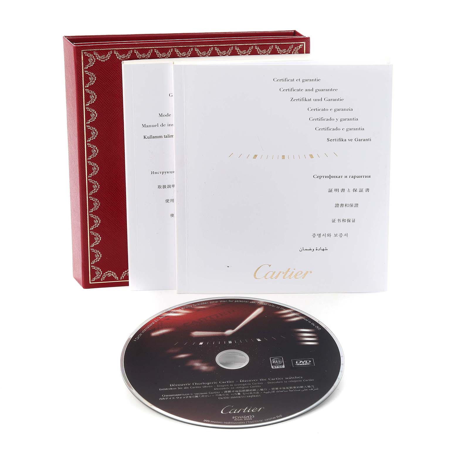 The image shows a Cartier Santos W20099C4 Men
s Steel and Gold (two tone) Silver Dial W20099C4 Men
s Steel and Gold (two tone) Silver Dial model
s red box, warranty certificate, and a DVD from a front angle.