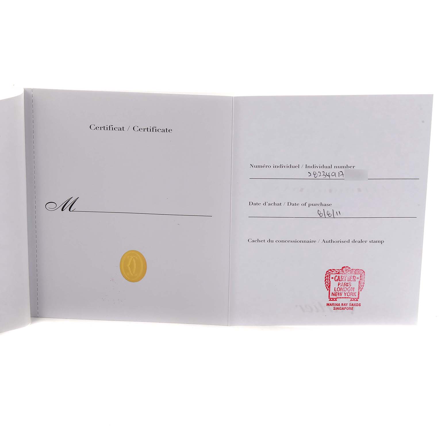 The image shows an open certificate book for the Santos model by Cartier, displaying numbers, a date, and a dealer stamp.