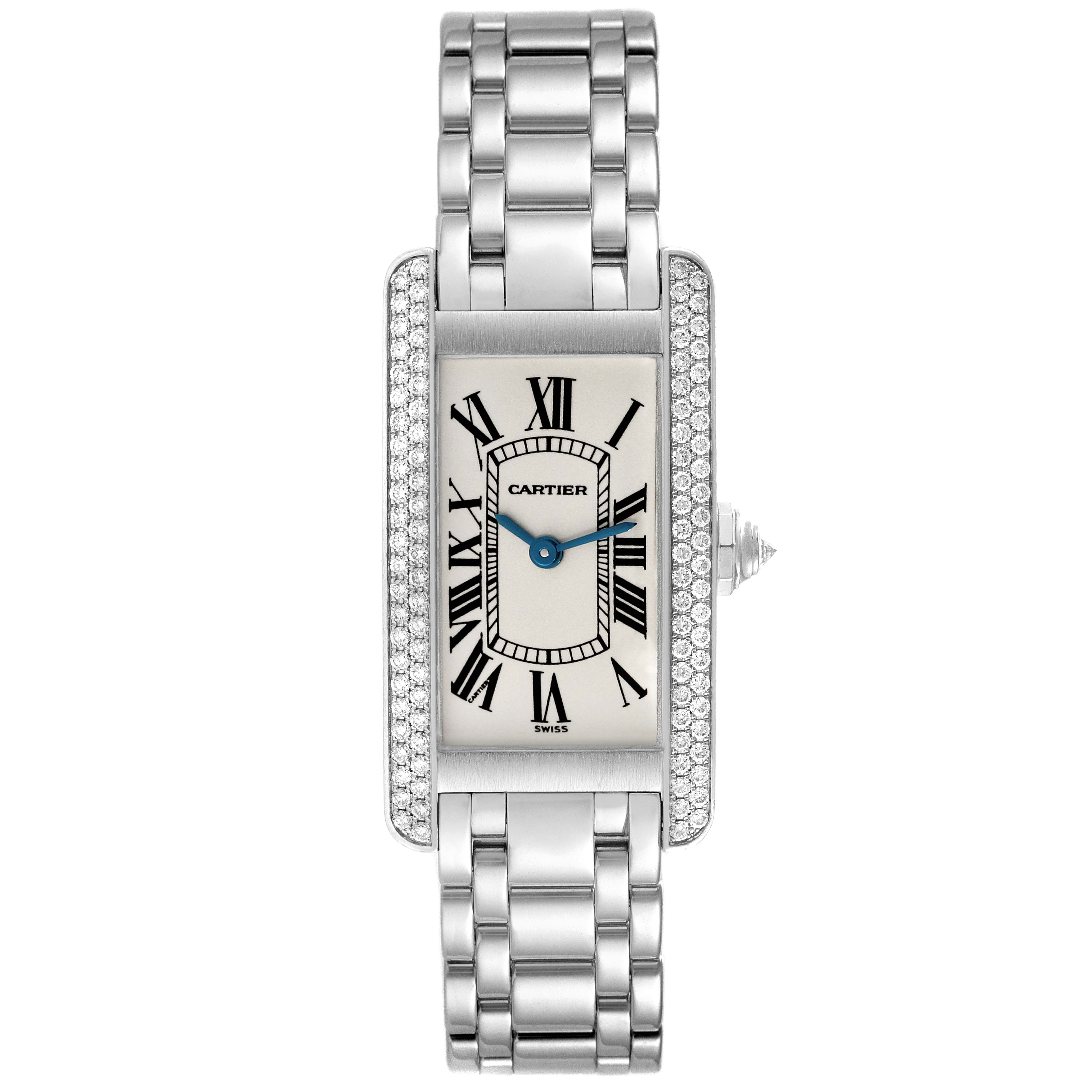 The image shows a top-down view of a Cartier Tank Americaine WB7018L1 Women's White Gold Silver Dial WB7018L1 Women's White Gold Silver Dial watch, highlighting its face, bracelet, and diamond-adorned bezel.