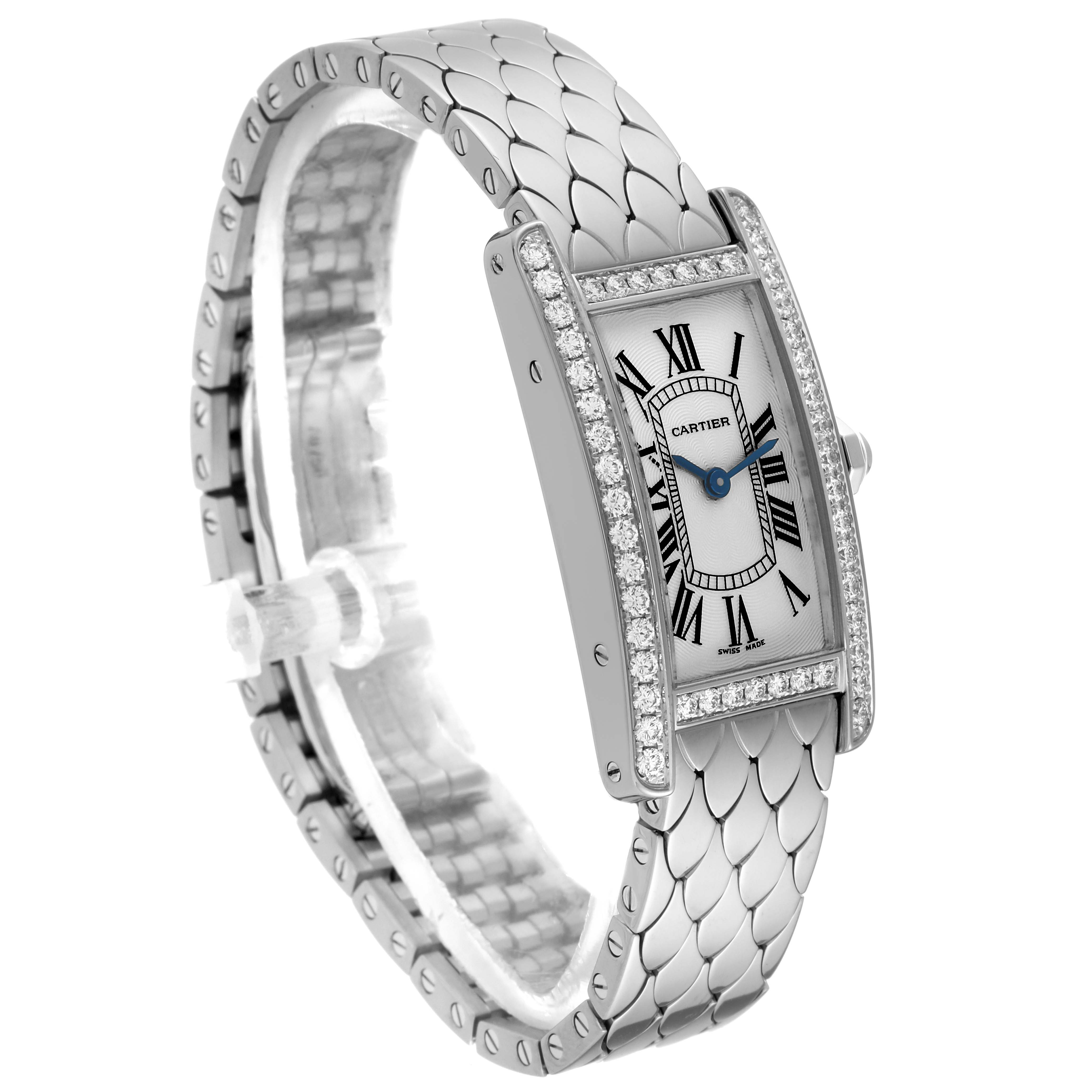 The image shows a Cartier Tank Americaine WB710009 Women's White Gold Silver Dial WB710009 Women's White Gold Silver Dial watch at a three-quarter angle, highlighting its rectangular case, diamond bezel, and stainless steel bracelet.