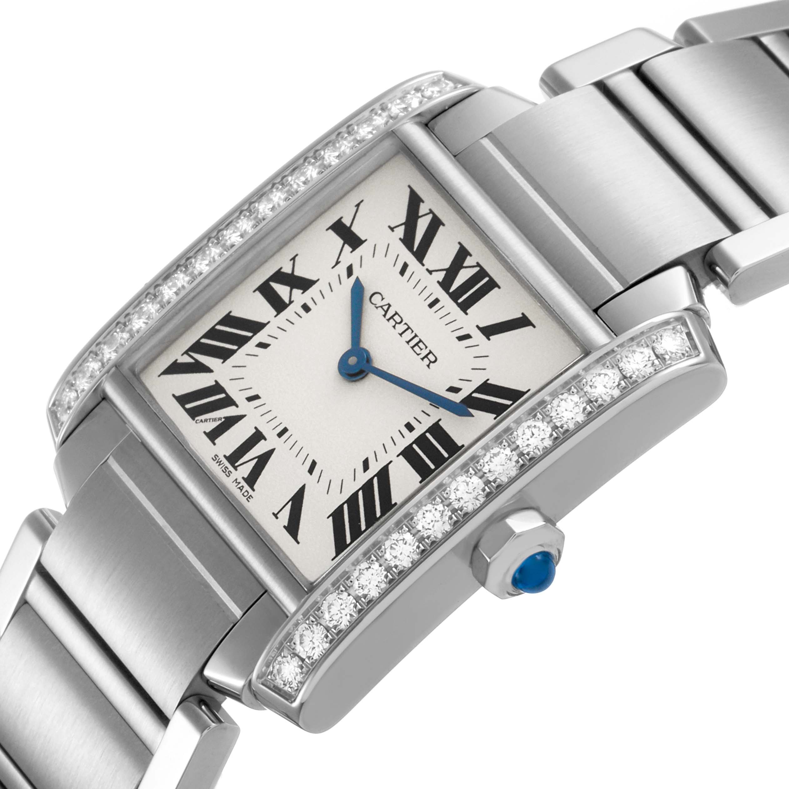 The Cartier Tank Francaise W4TA0009 Women's Stainless Steel Silver Dial watch is shown at an angle highlighting the diamond-encrusted bezel, Roman numeral dial, and part of the metal bracelet.