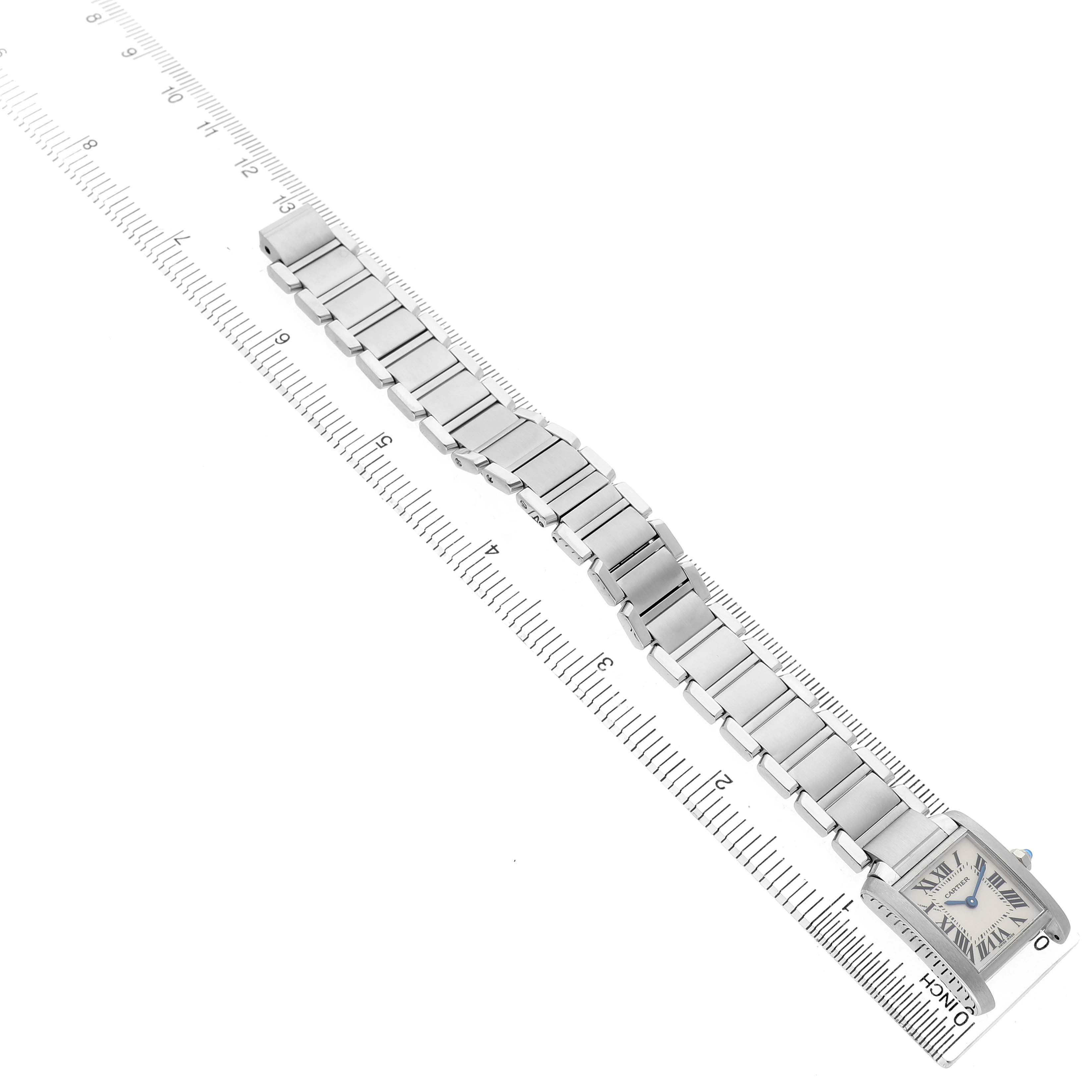The Cartier Tank Francaise W51008Q3 Women's Stainless Steel Silver Dial watch is shown from an overhead angle, displaying its bracelet and rectangular face.