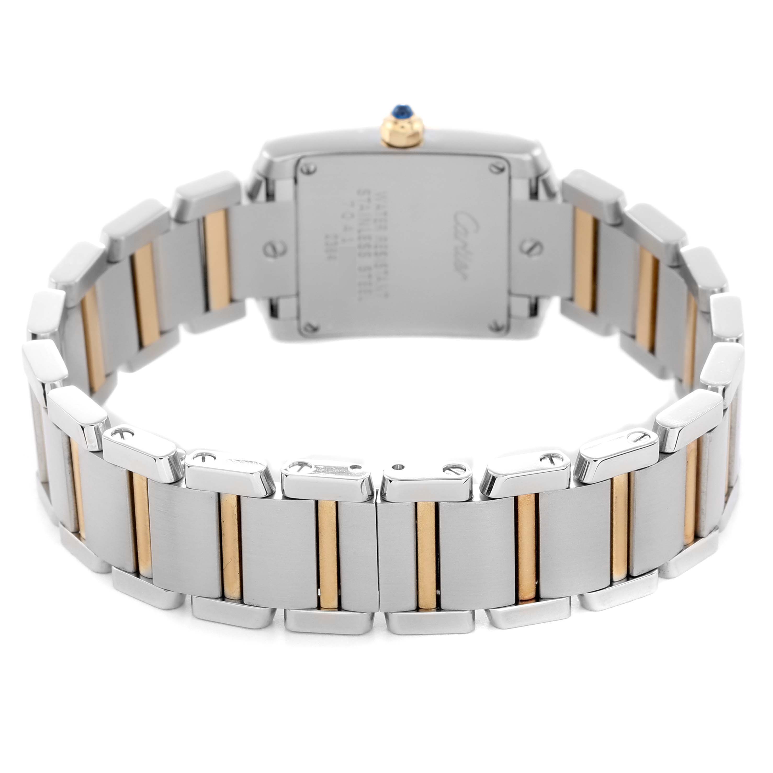 The Cartier Tank Française watch is shown from the back, highlighting its case back and two-tone bracelet.