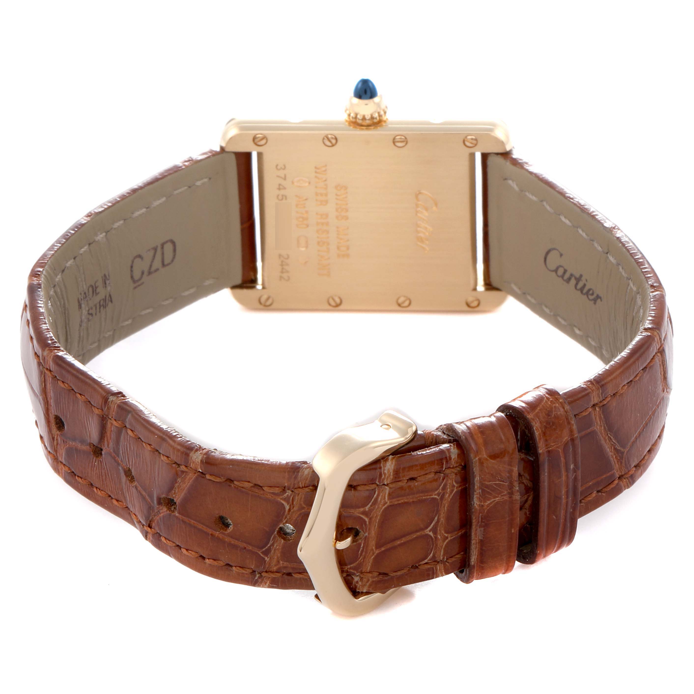 The image shows the back view of a Cartier Tank Louis W1529856 Women
s Yellow Gold Silver Dial W1529856 Women
s Yellow Gold Silver Dial watch, highlighting the gold case, blue crown, and brown leather strap.