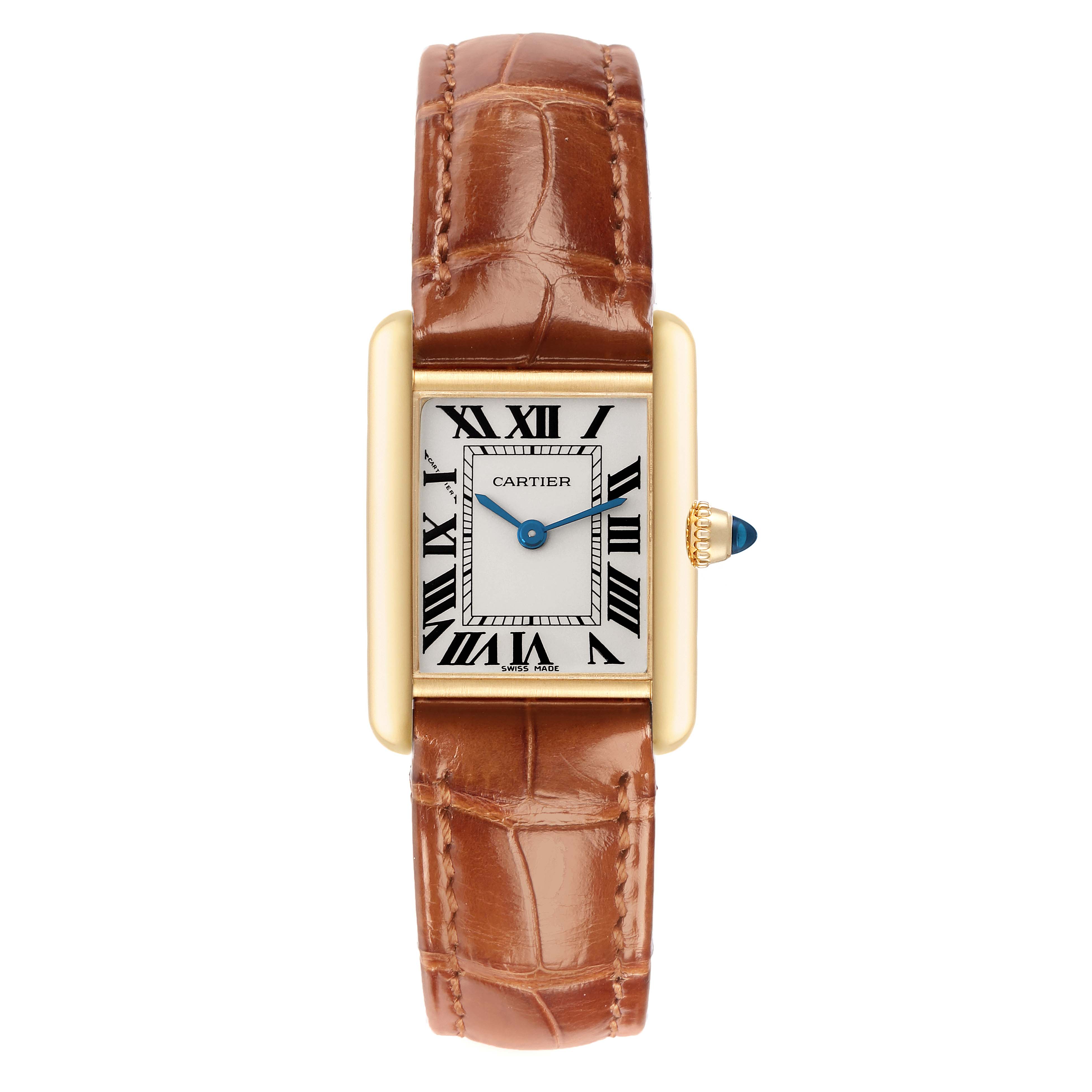 The Cartier Tank Louis W1529856 Women
s Yellow Gold Silver Dial W1529856 Women
s Yellow Gold Silver Dial watch is shown from a top view, highlighting its rectangular face, brown leather strap, and blue hands.