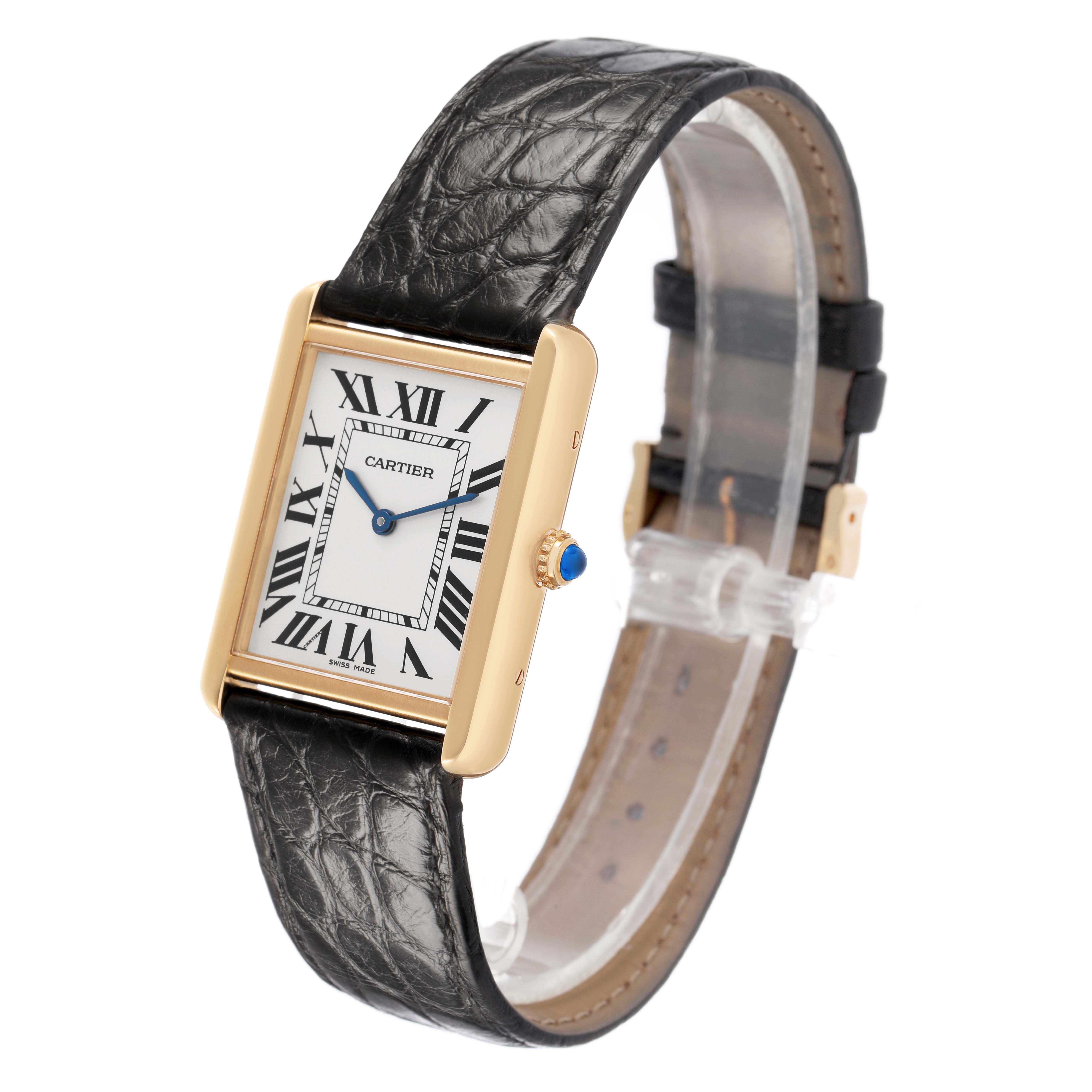 The Cartier Tank Solo W5200004 Men's Yellow Gold Silver Dial watch is shown at a front-left angle, highlighting its dial, leather strap, and crown with a blue gem.