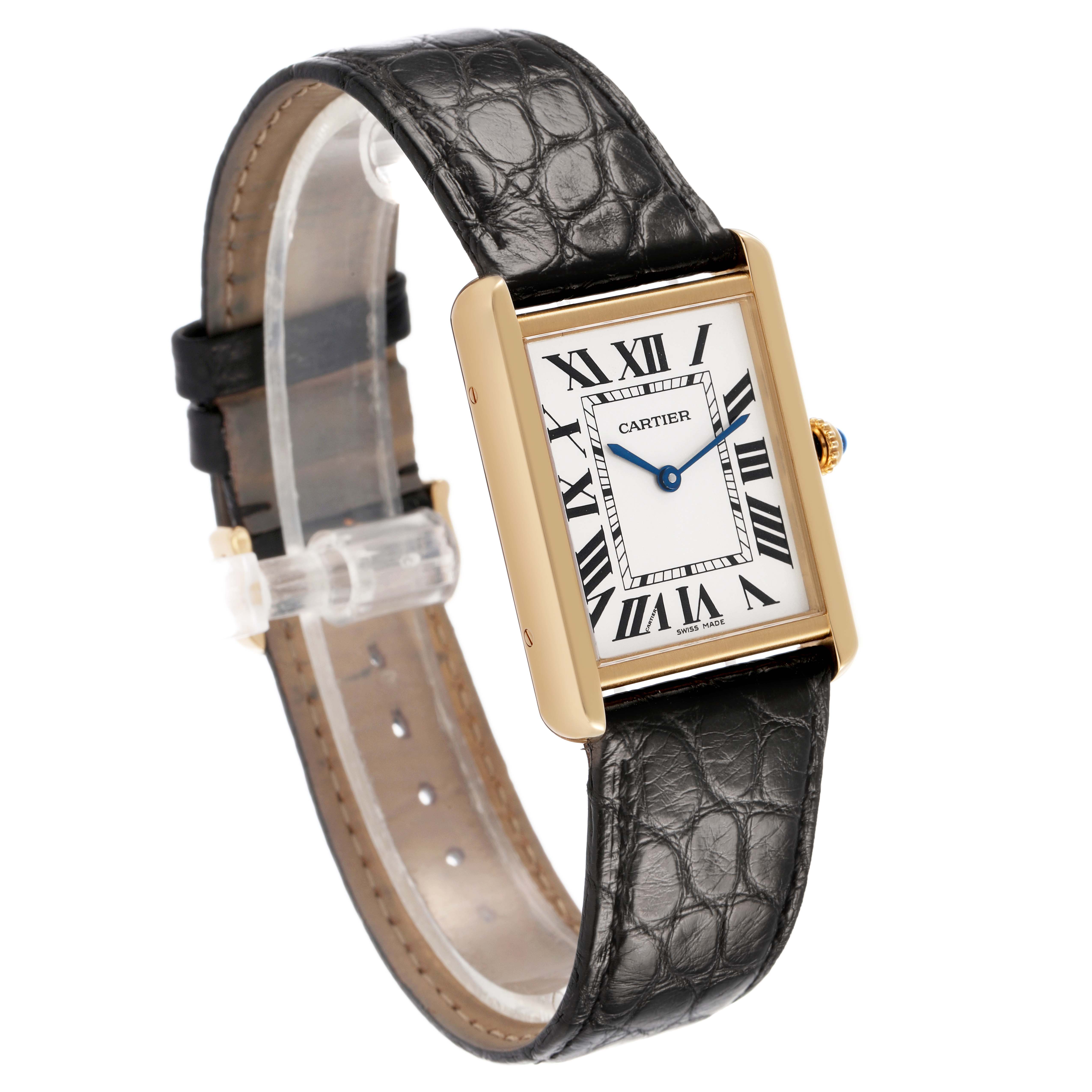 The Cartier Tank Solo W5200004 Men's Yellow Gold Silver Dial watch is shown at a three-quarter angle, highlighting its rectangular face, Roman numerals, leather strap, and gold casing.