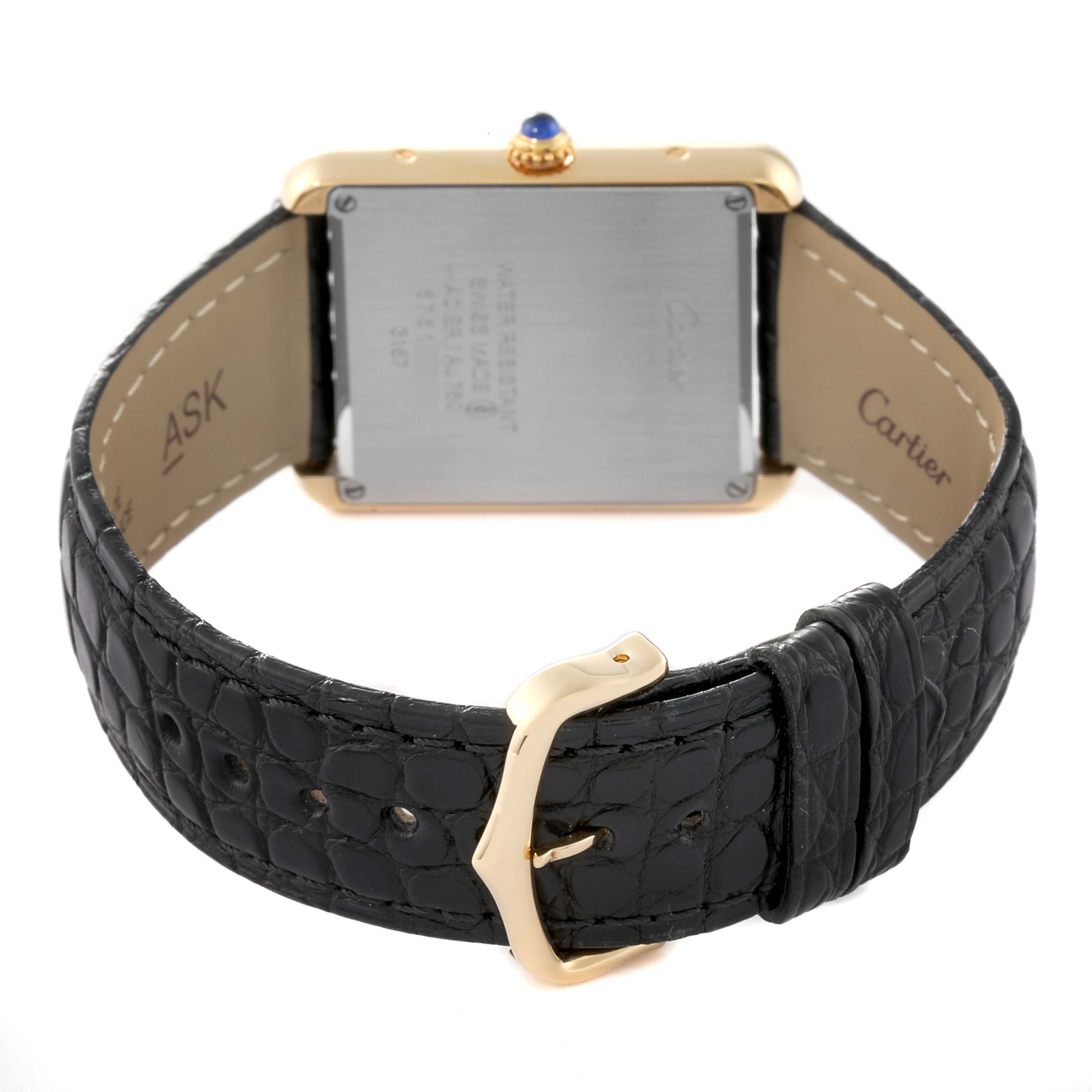 The image shows the back view of the Tank Solo model by Cartier, highlighting the clasp, buckle, and leather strap.