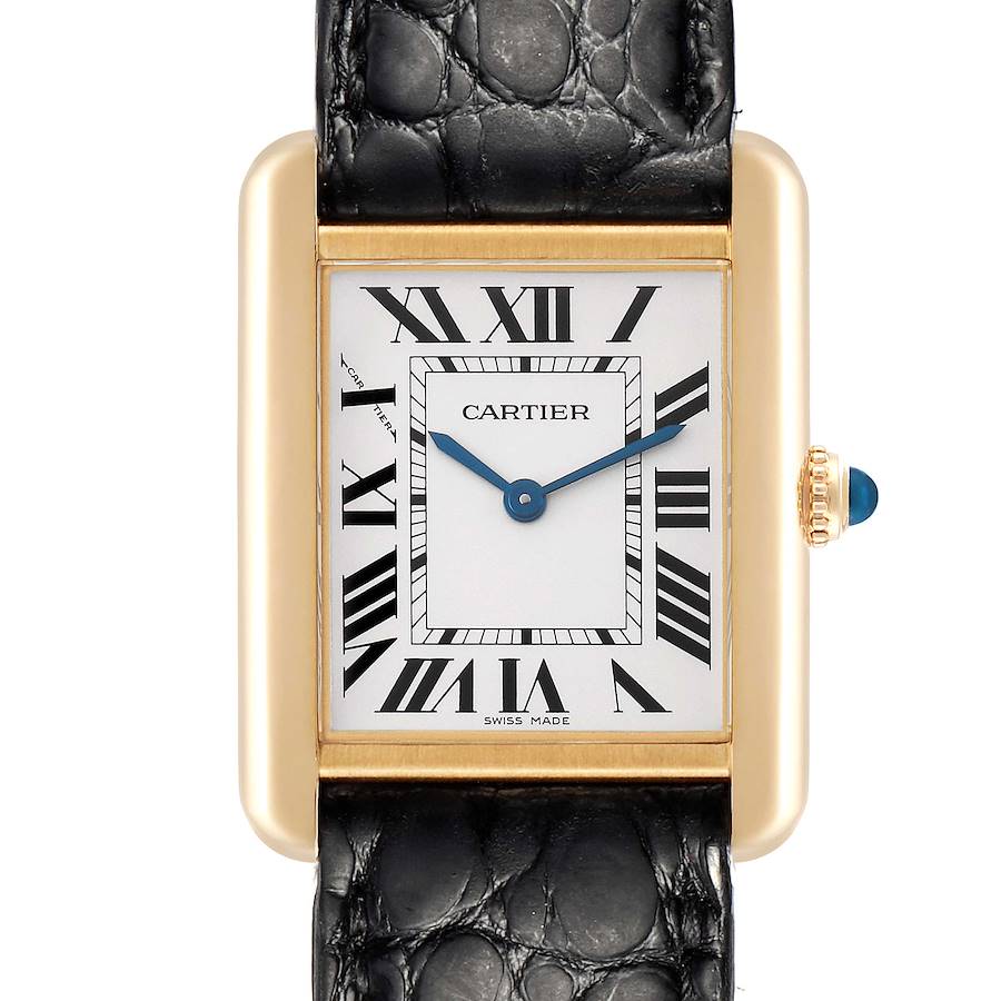 The Cartier Tank Solo watch is shown from a front angle, highlighting its Roman numeral dial, gold case, crown, and black strap.