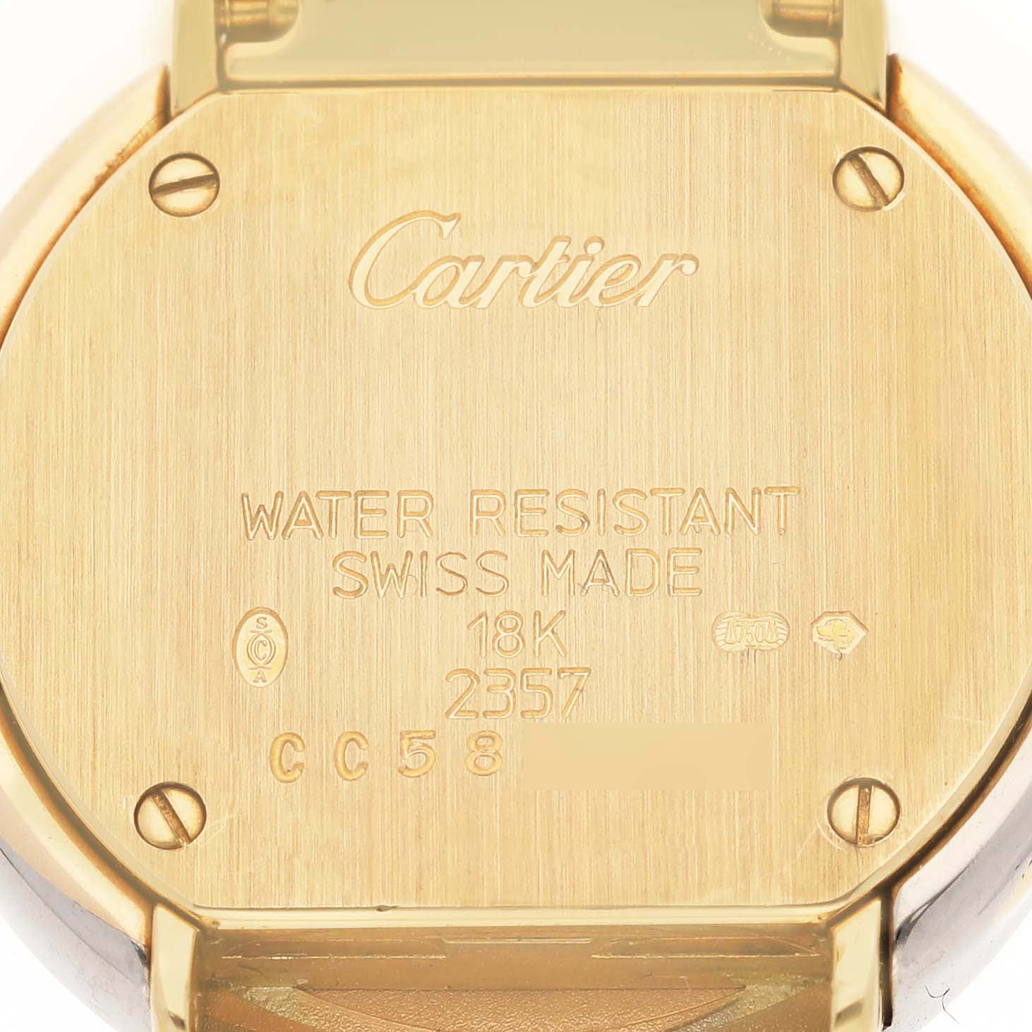 The image shows the back case of a Cartier Trinity WG200151 Women's Yellow Gold Silver Dial WG200151 Women's Yellow Gold Silver Dial model watch, detailing its water resistance and 18K gold material.
