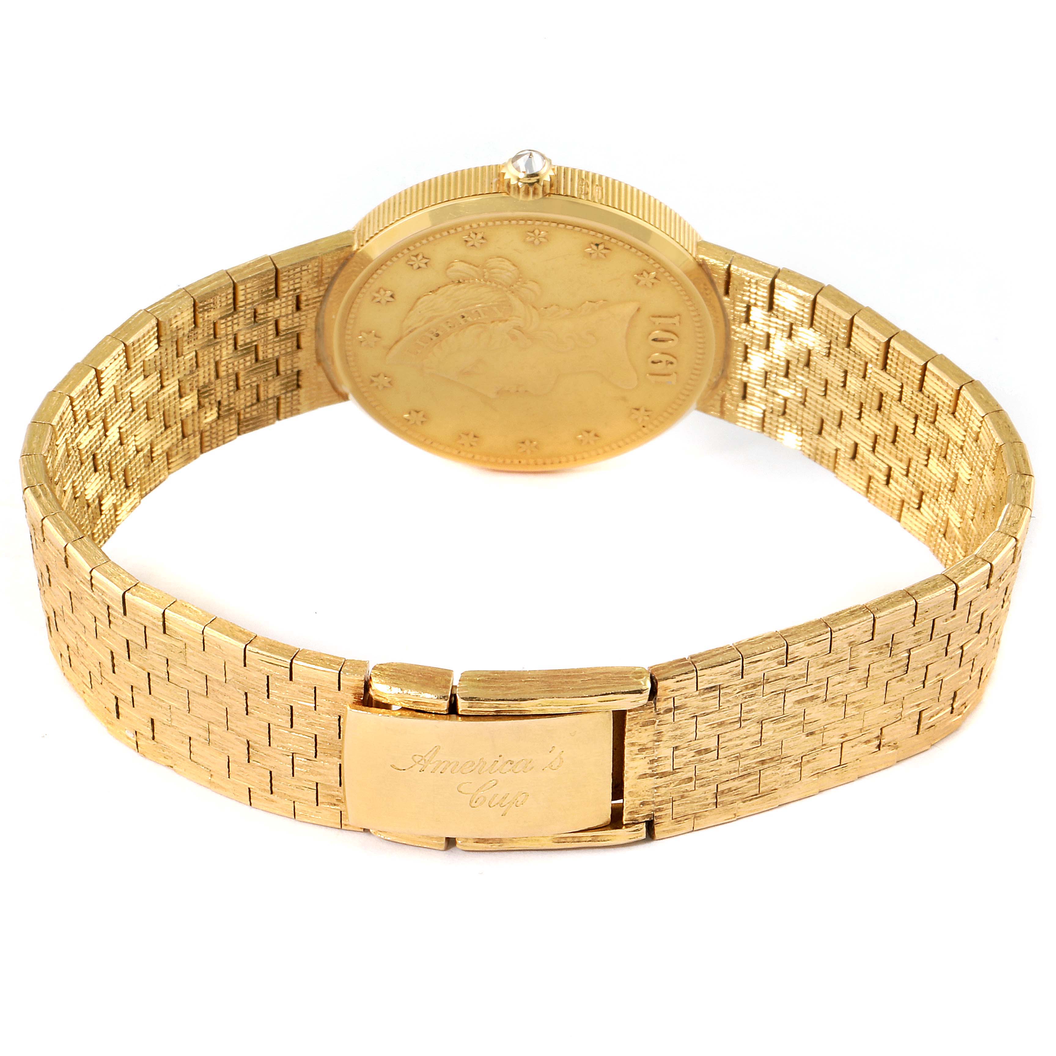 The Corum 1901 Women's Yellow Gold Black Dial 1901 Women's Yellow Gold Black Dial Coin 10 Dollars Eagle Yellow Gold Ladies Watch 1901 model is shown from the back, highlighting its band and clasp.