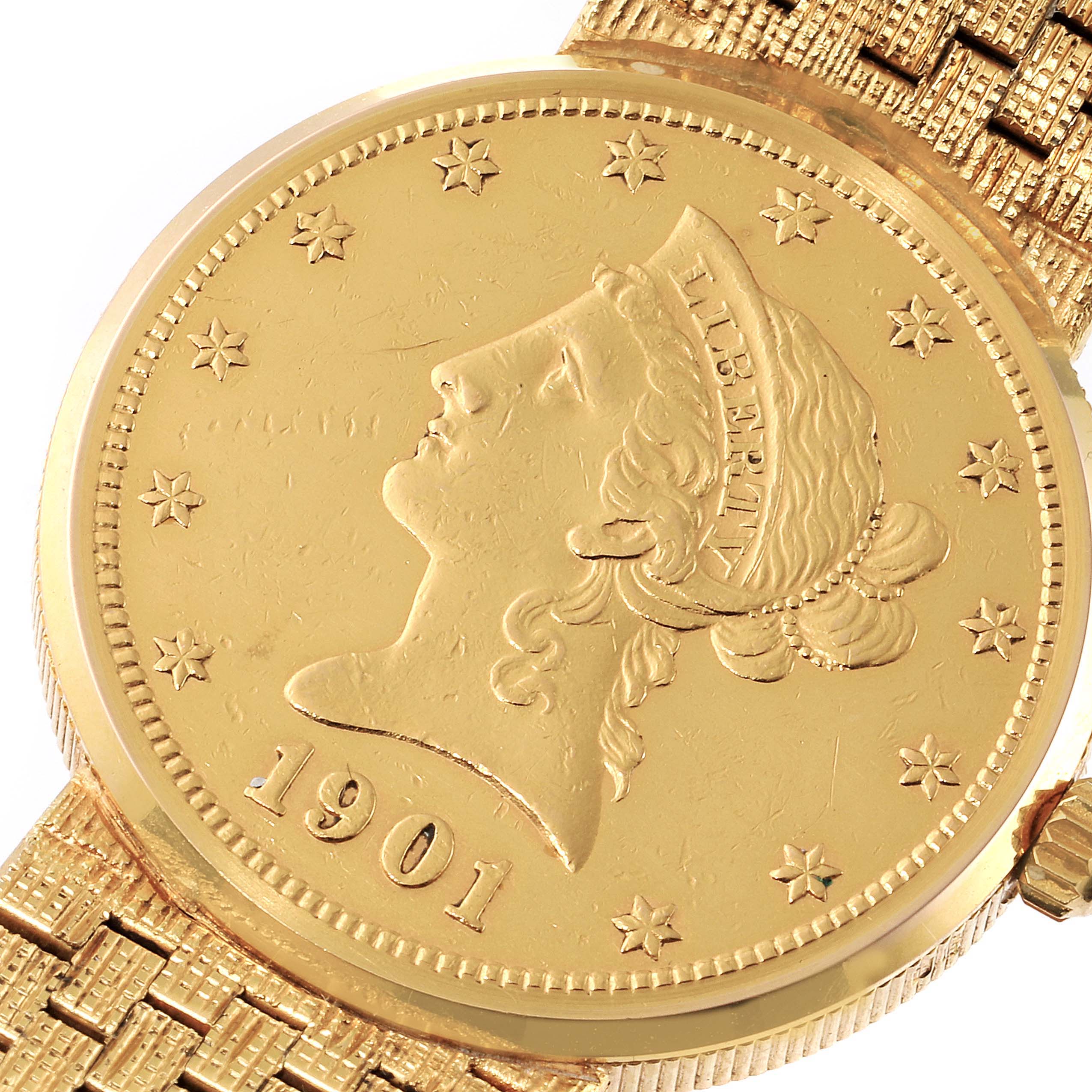 This image shows a close-up of the face and partial bracelet of the Corum 1901 Women's Yellow Gold Black Dial 1901 Women's Yellow Gold Black Dial Coin 10 Dollars Eagle Yellow Gold Ladies Watch 1901 model.