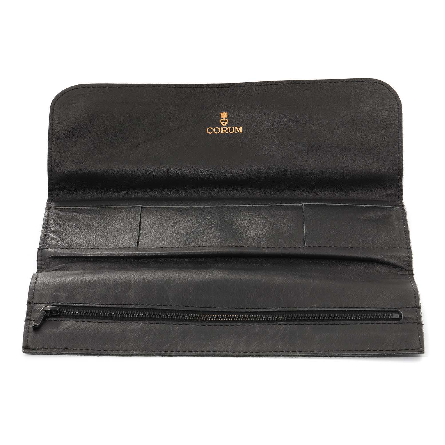 This image shows an open Corum 1902 Women's Yellow Gold Black Dial 1902 Women's Yellow Gold Black Dial leather watch pouch for the Coin 5 Dollars Double Eagle Yellow Gold Ladies Watch 1902 model.