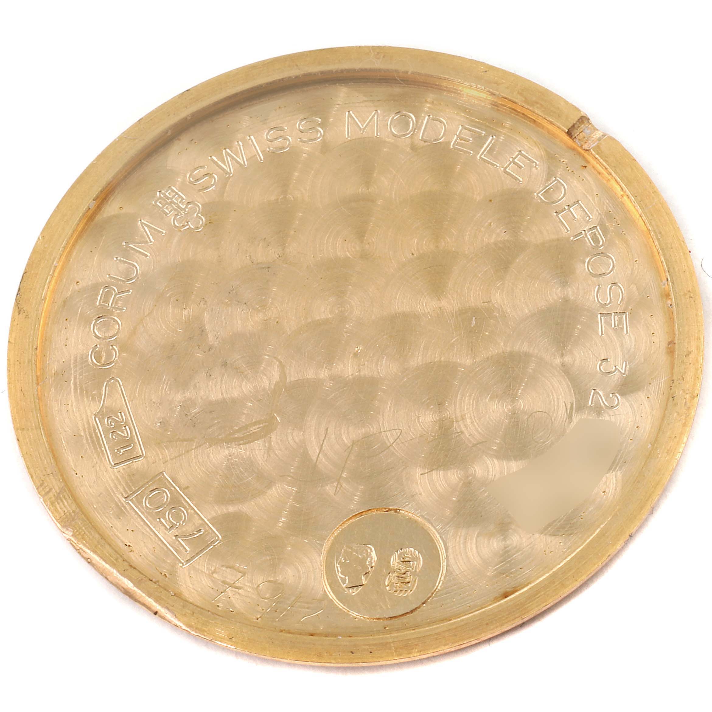 This is the inner case back of the Corum 1902 Women's Yellow Gold Black Dial 1902 Women's Yellow Gold Black Dial Coin 5 Dollars Double Eagle Yellow Gold Ladies Watch 1902 model, showing engravings and stamp marks.